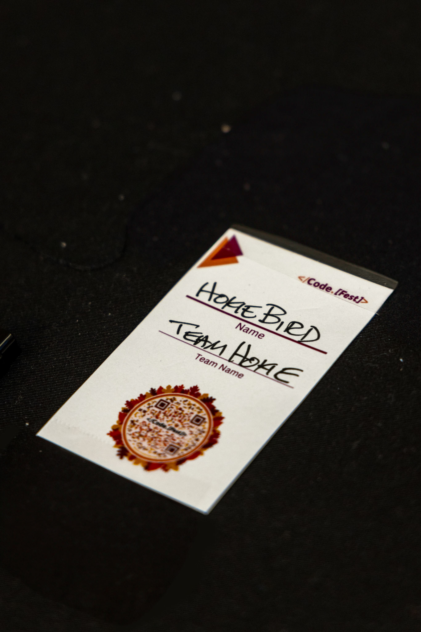 The badge card with the event website QR code
