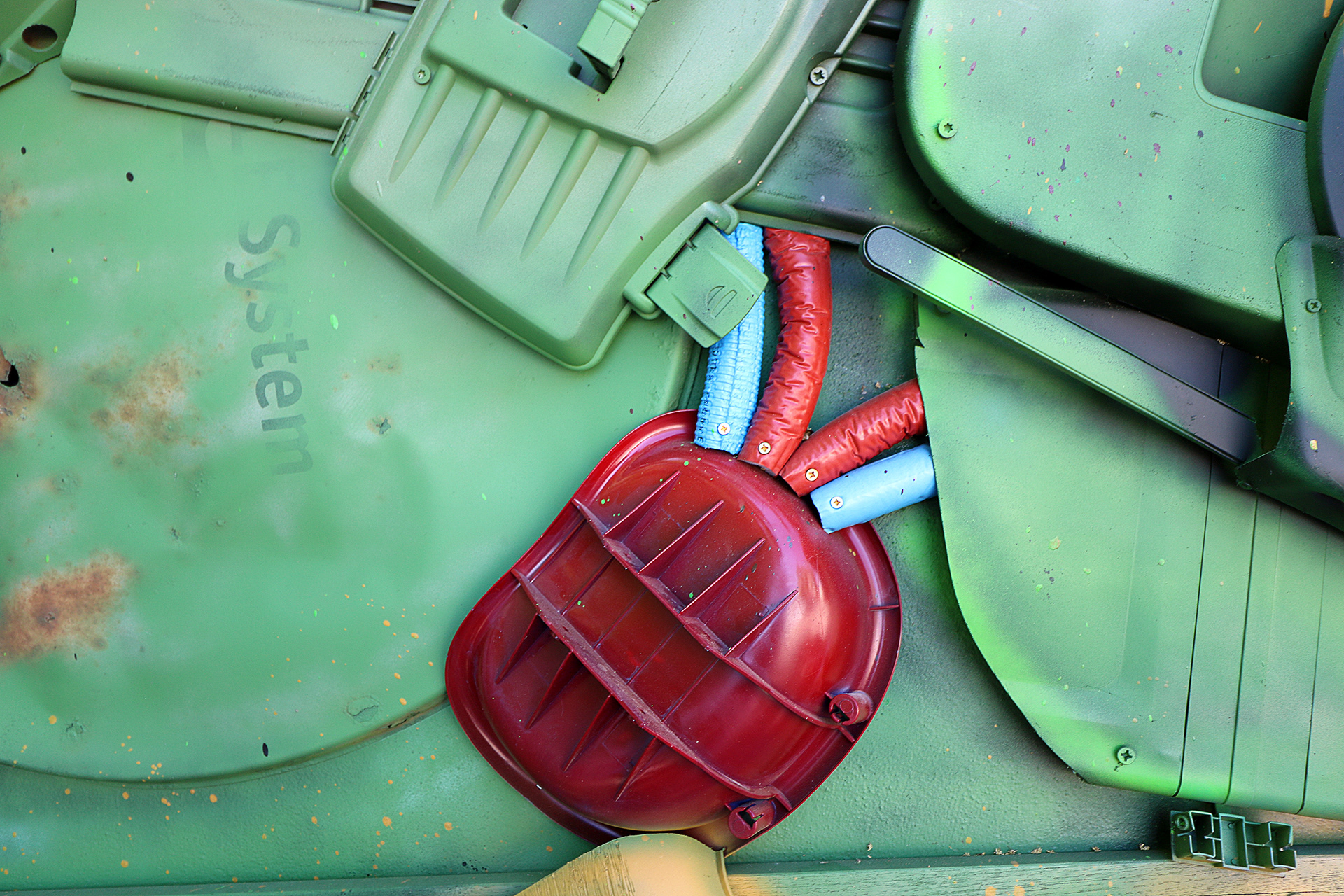 Detail of the red throat element and layered reclaimed plastics in Giant Chameleon.