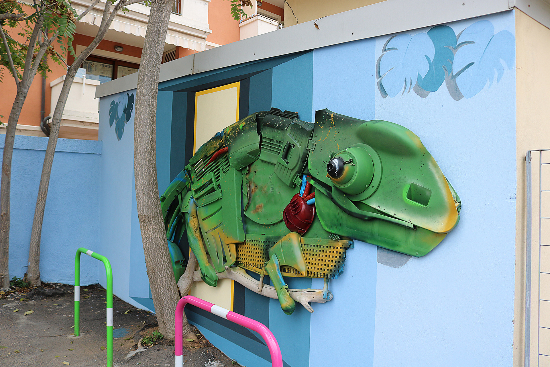 Giant Chameleon installed on the exterior wall of Olbia railway station.