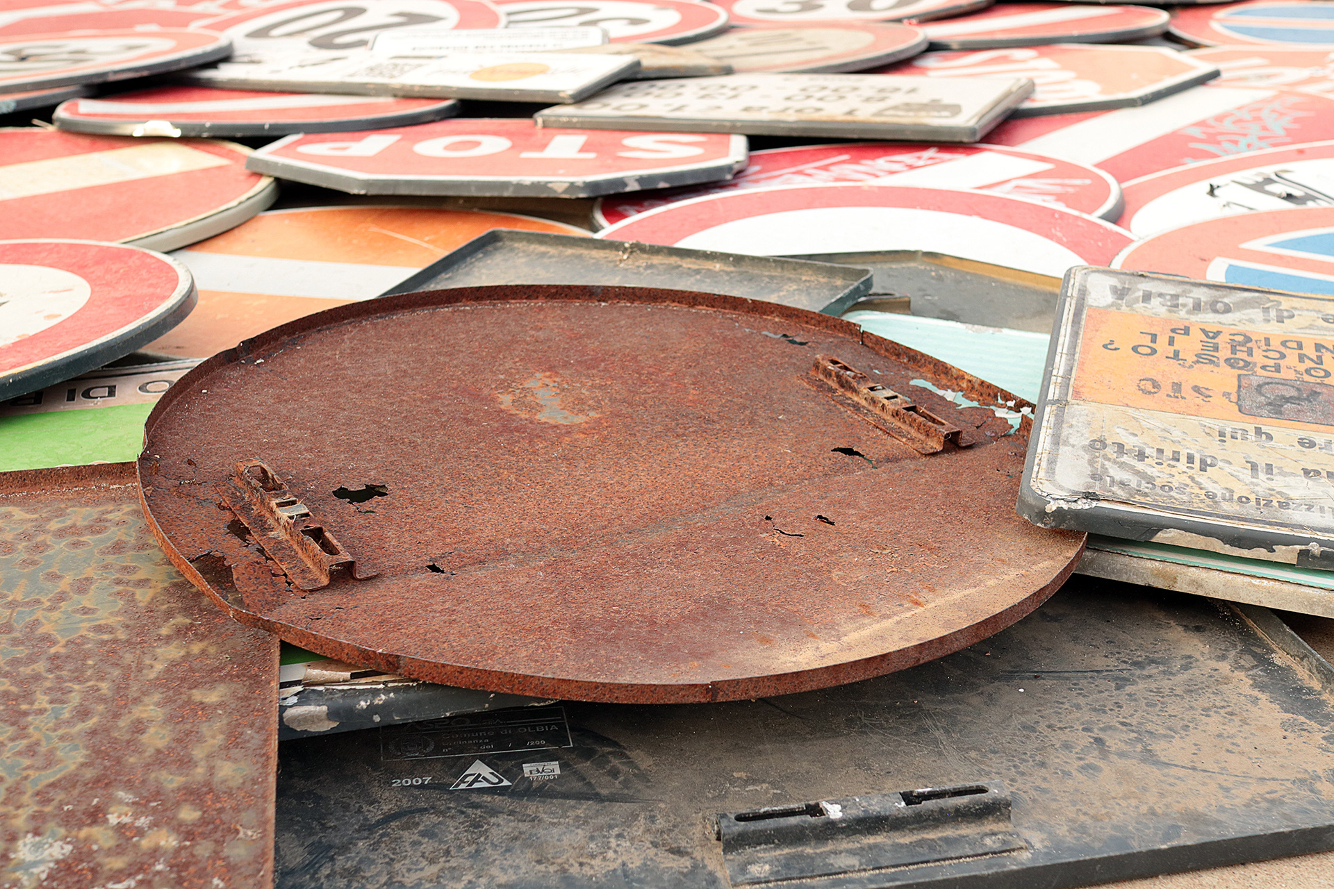 Close-up of the rusted reverse sides of decommissioned road signs used by Scoobafish in the temporary installation Concerto 0.