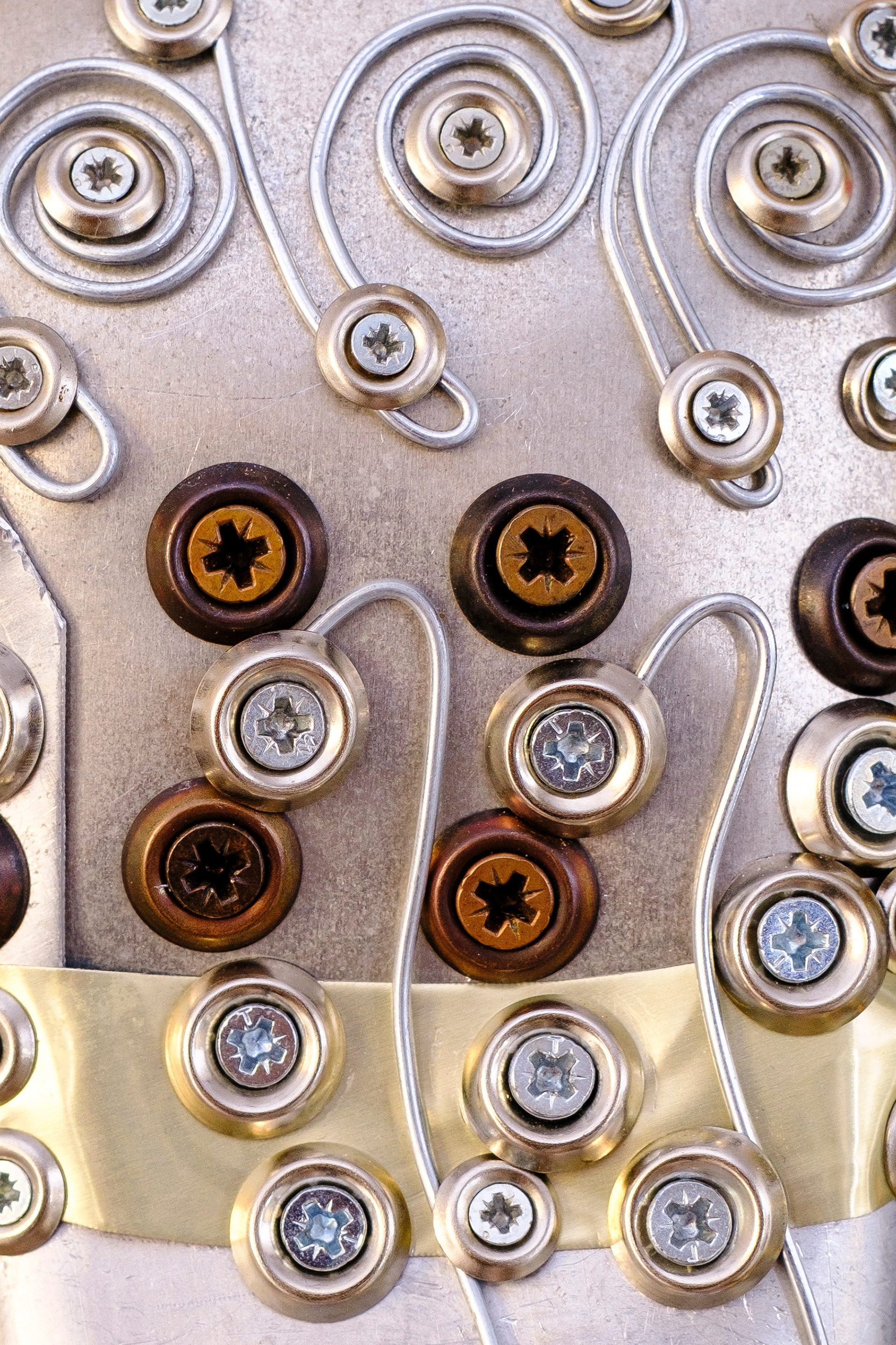 Concentric circular pattern with metallic bottle caps