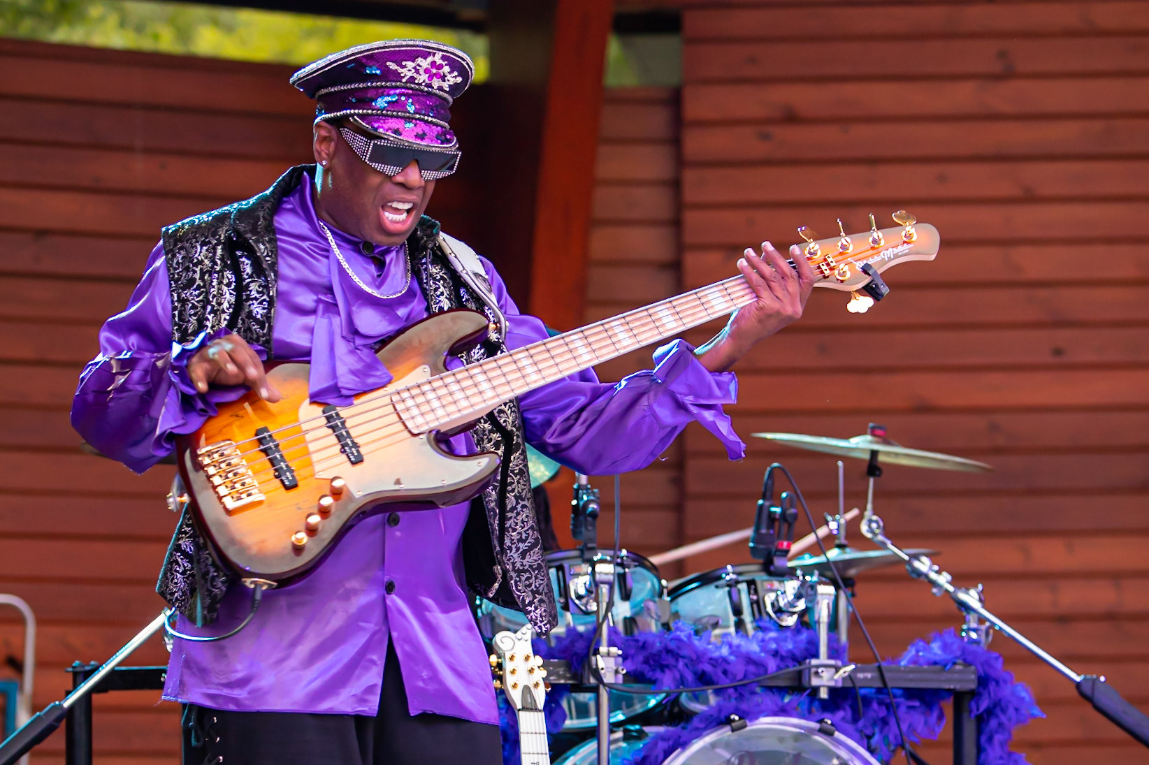 Purple Madness bass player. Digital still. July 23, 2021