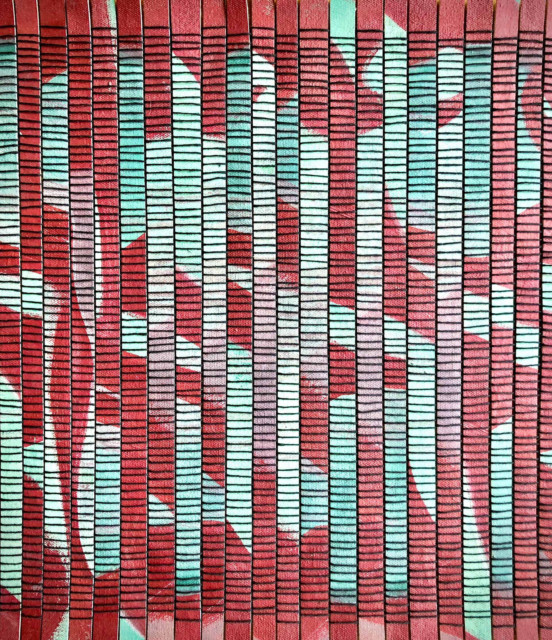 Section of a weaving; black cotton warp, slices of painted canvas as the weft, woven on a Saori loom
