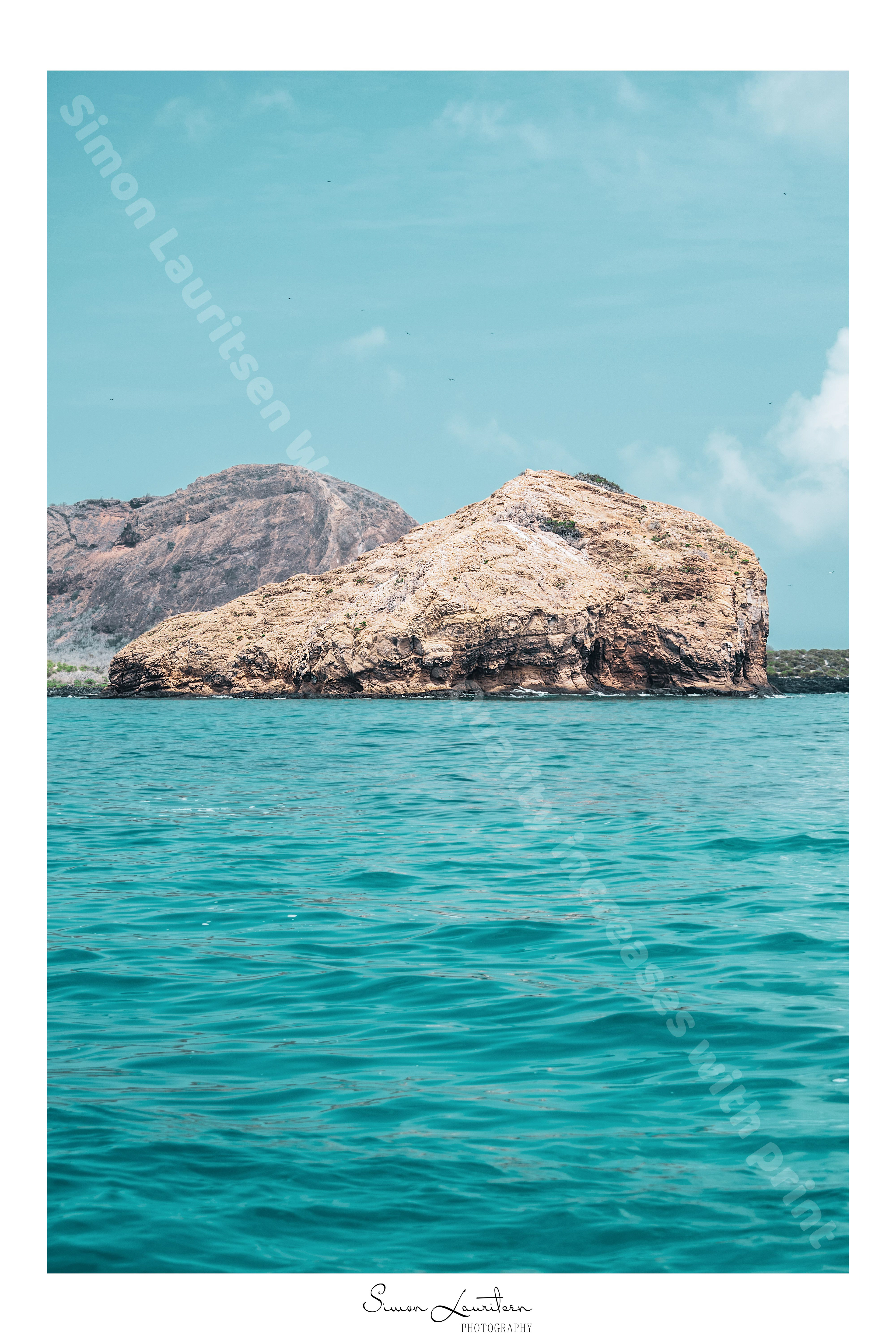 NAT-2 : On a boat trip around San Cristobal, we saw the most blue water I have ever seen. So blue that I had to dial it down, because it looked so fake.