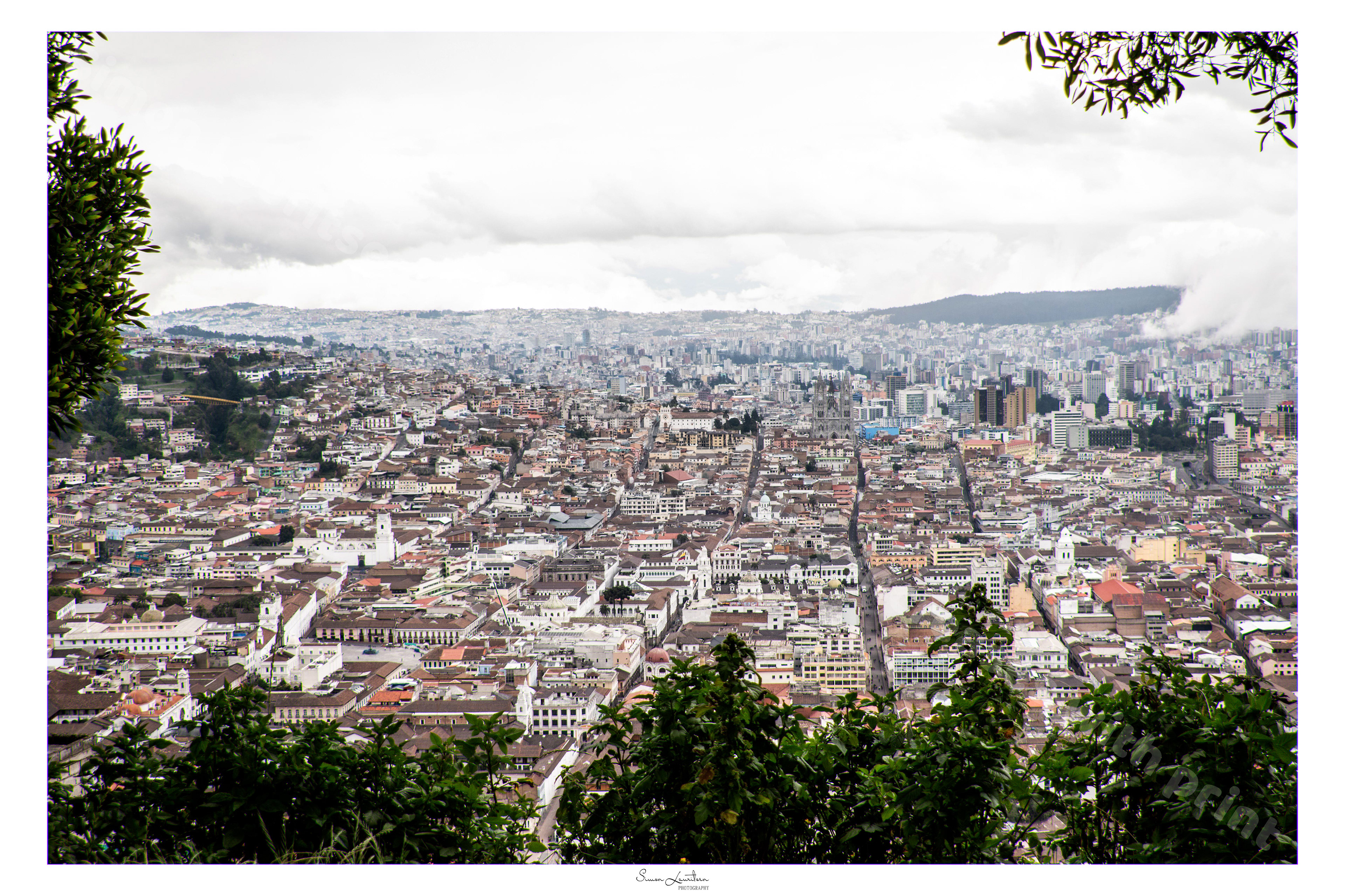 CITY-19: The view from a monument in Quito - Ecuador !! So cool city !! It is located at a latitude over 3000 meters, and are build in a kind of valley. It is so much longer than wide because of the mountains!