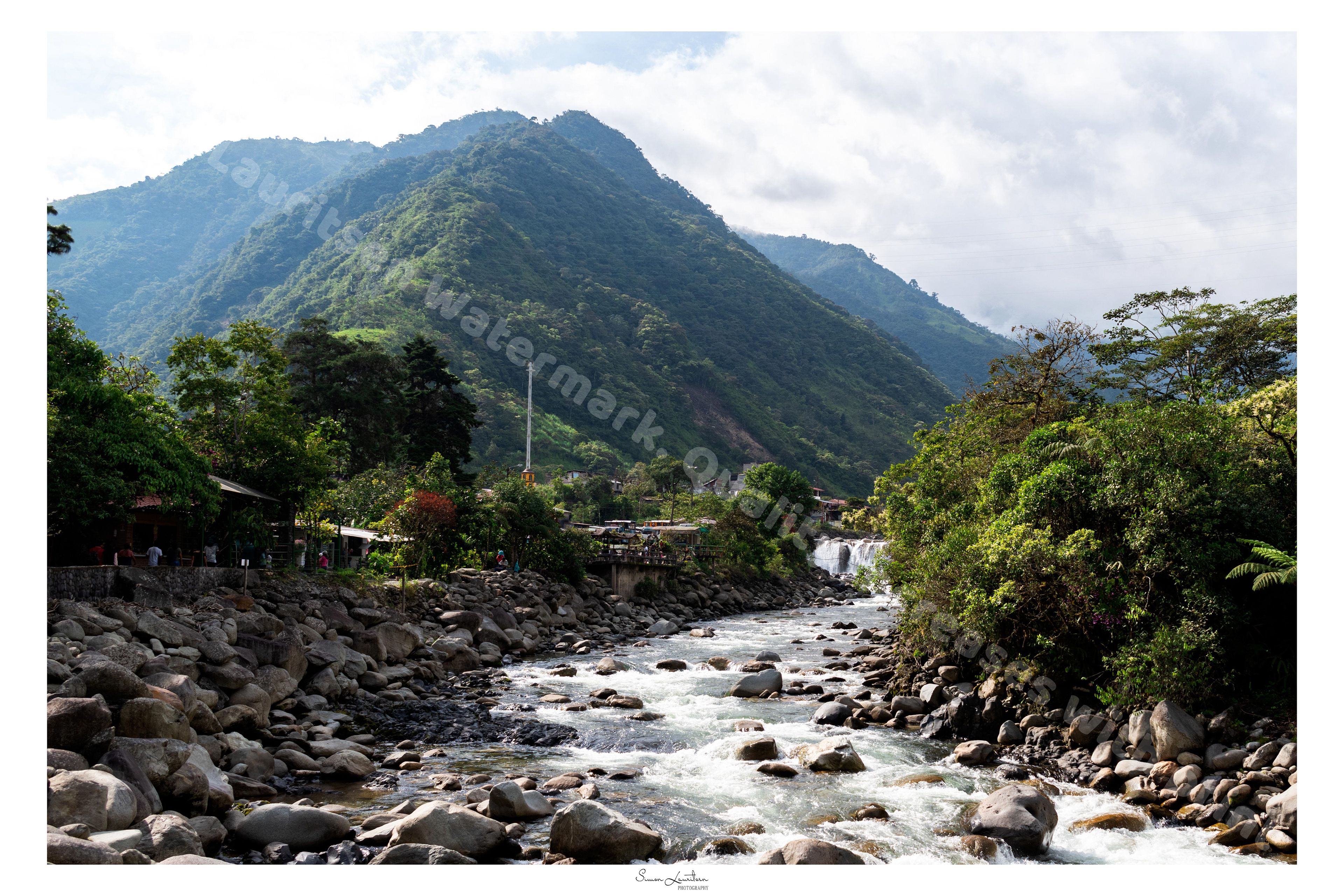LAN-1 : On a trip through Ecuador we visited a small adrenaline city called Baños. A lot of mountains surrounded the city, and made beautiful waterfalls through the landscape