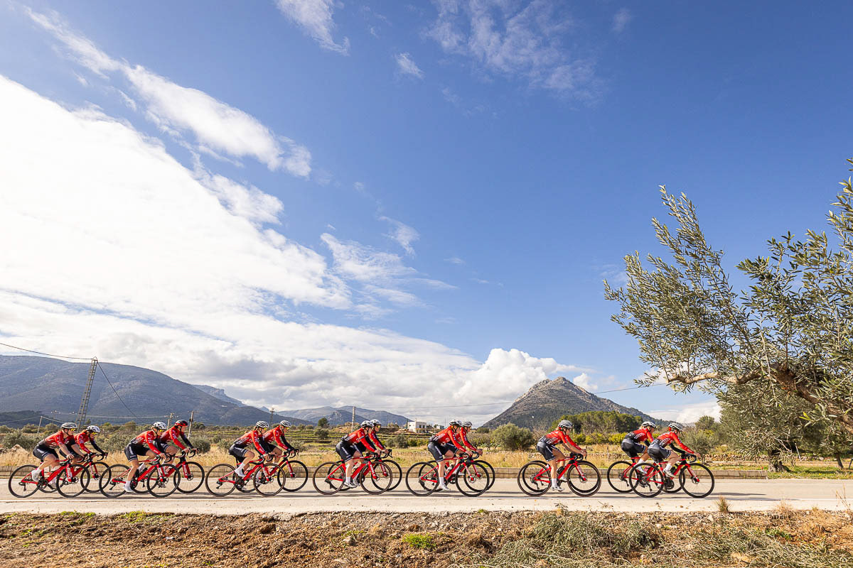 The whole team riding through the Spanish countryside