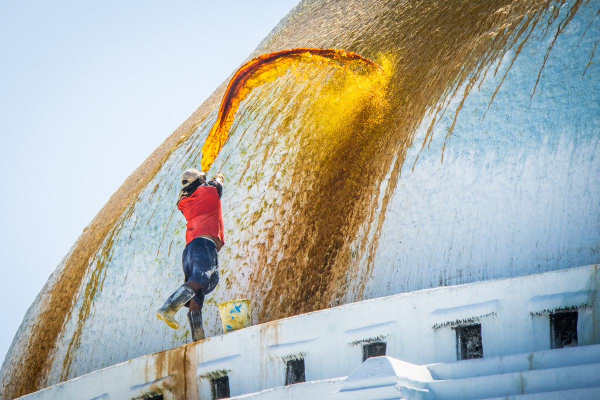 Orange saffron paint represents wisdom, purity, and spiritual awakening. It's application to the roof of the Boudhanath Stupa in Kathmandu is an important ritual