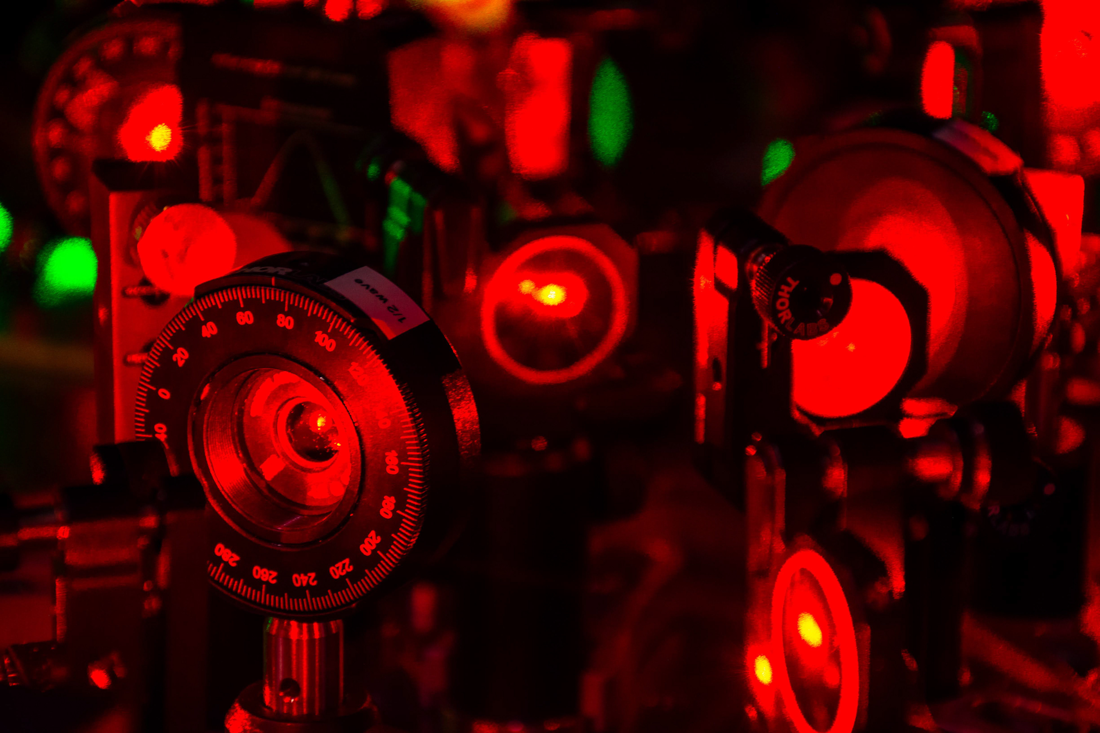 Closeup of lasers on an optical table