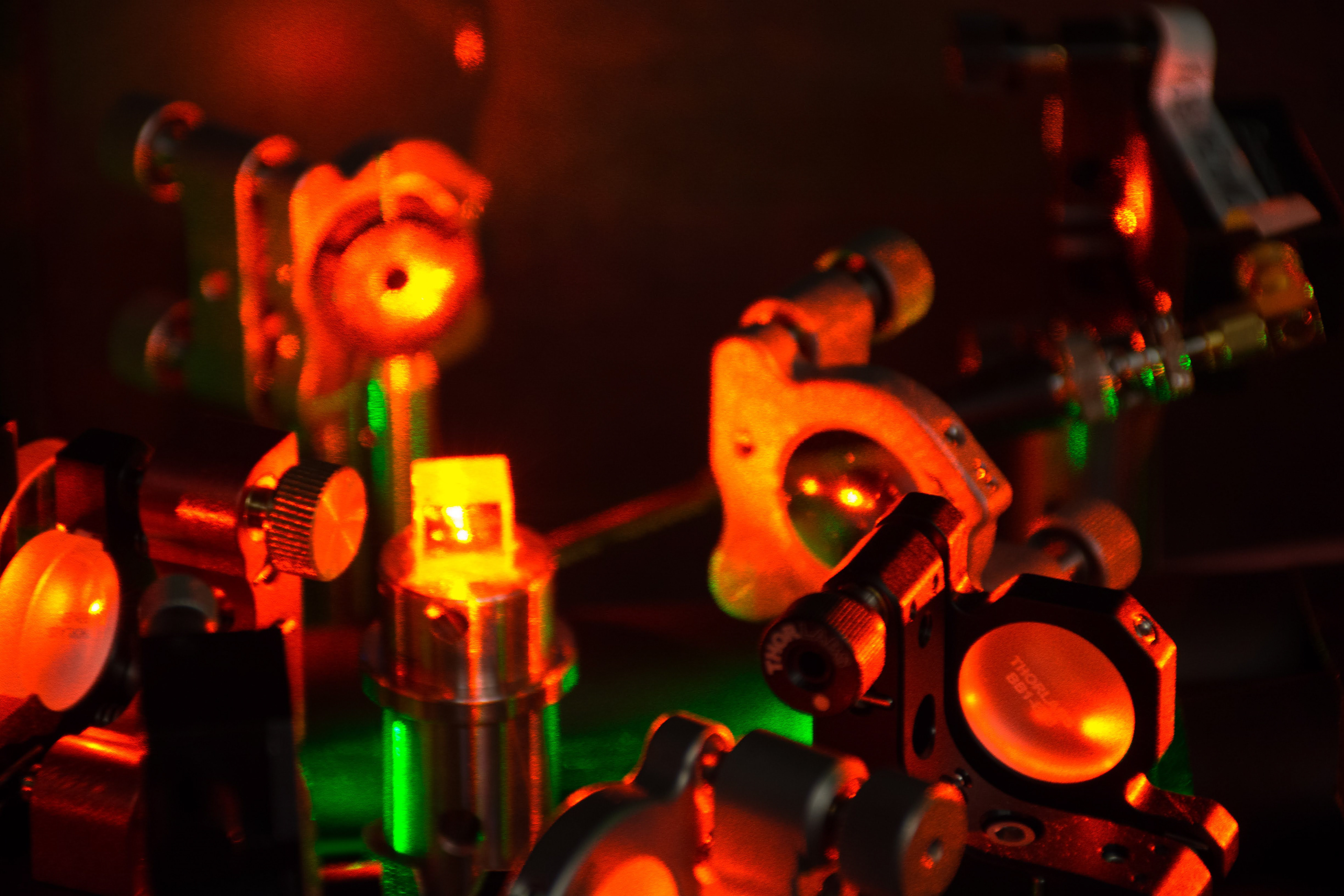 Closeup of lasers on an optical table