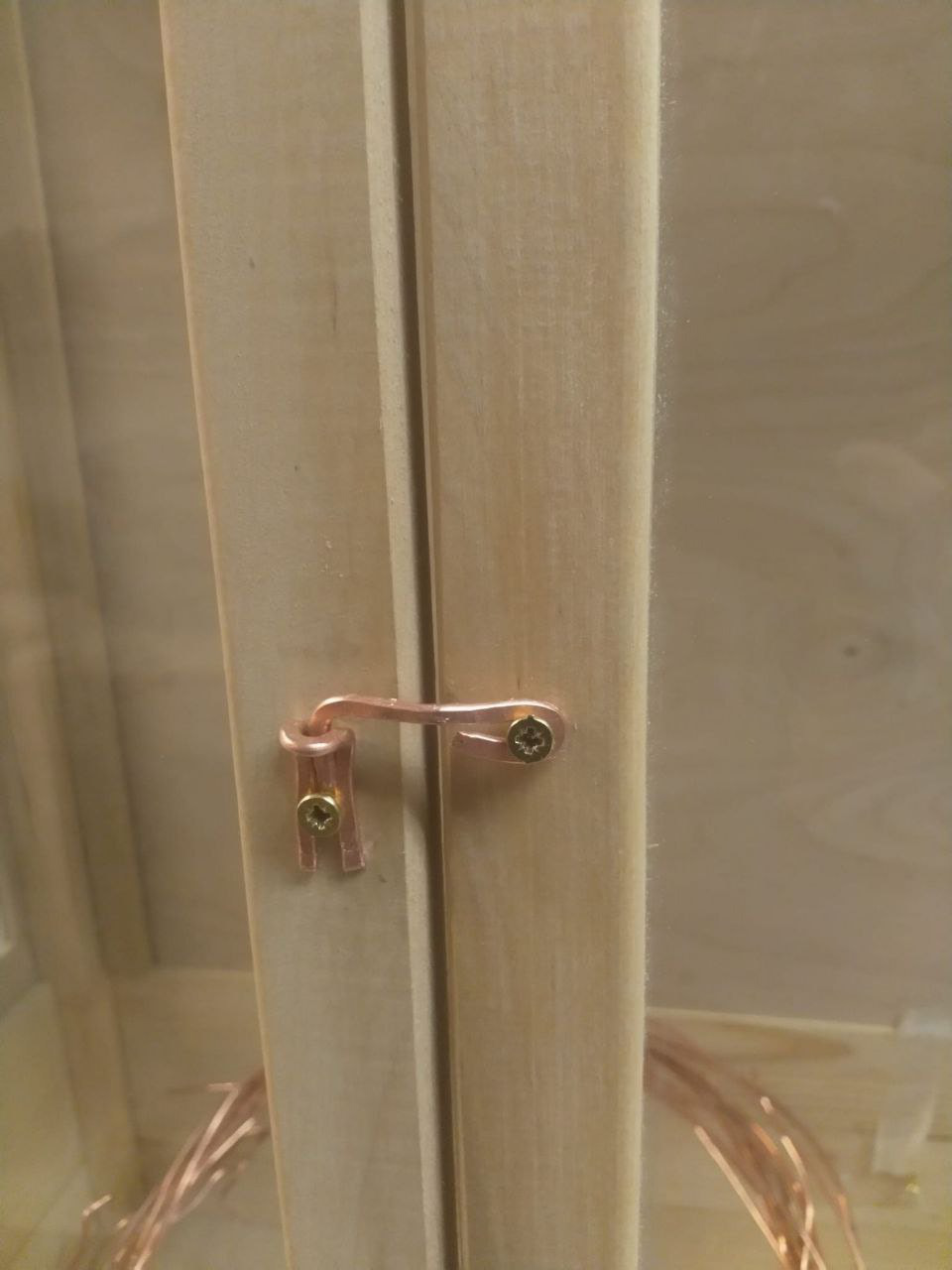 Opening hook made from (unwrapped repurposed electric chord) copper wire.