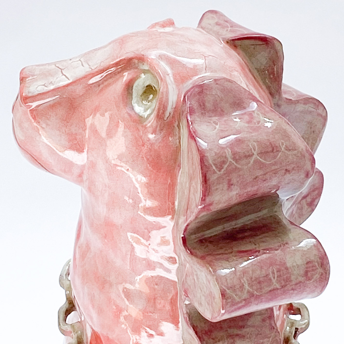Sculpture of pink dog in glazed ceramic