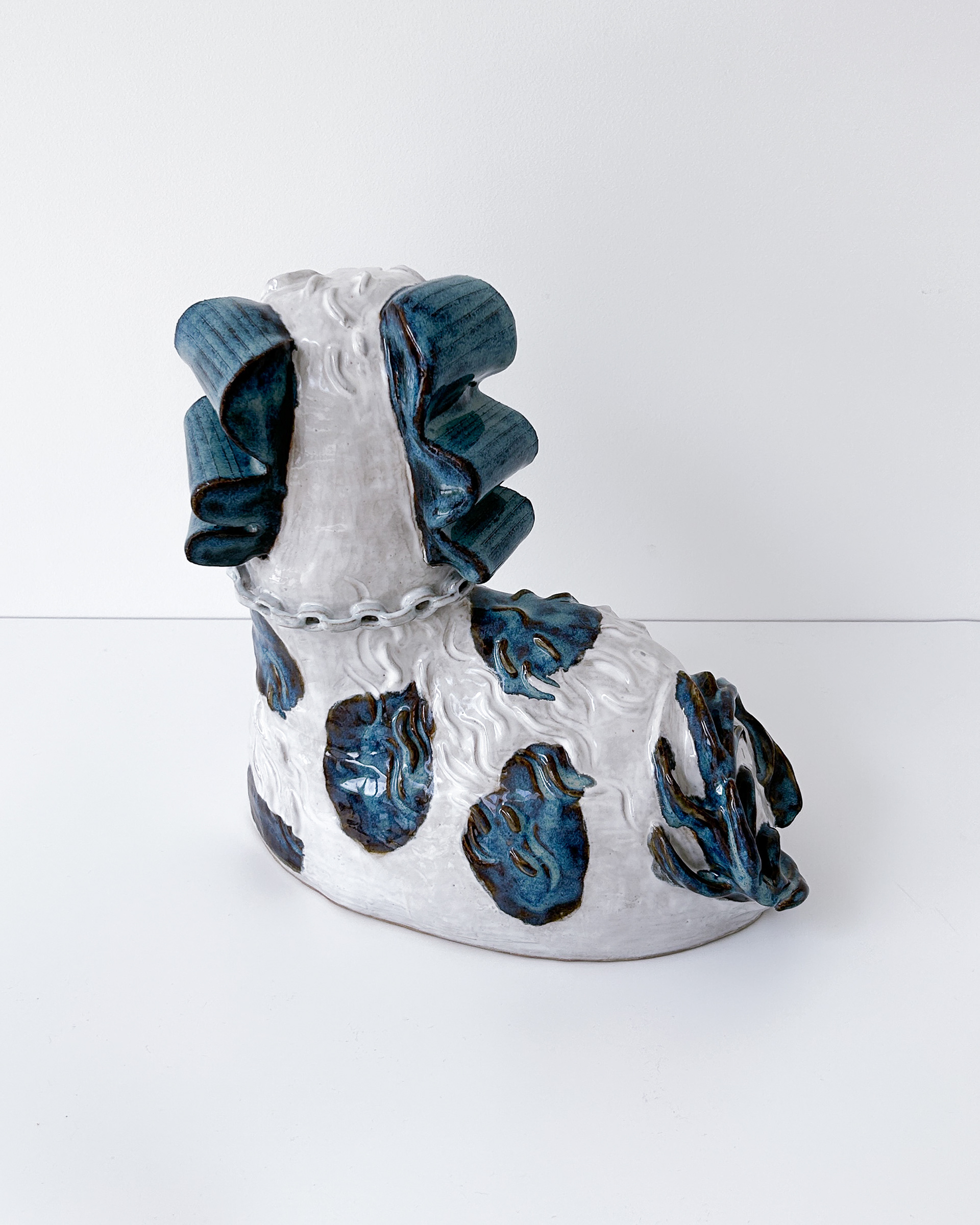 Blue and white spaniel sculpture in glazed ceramic