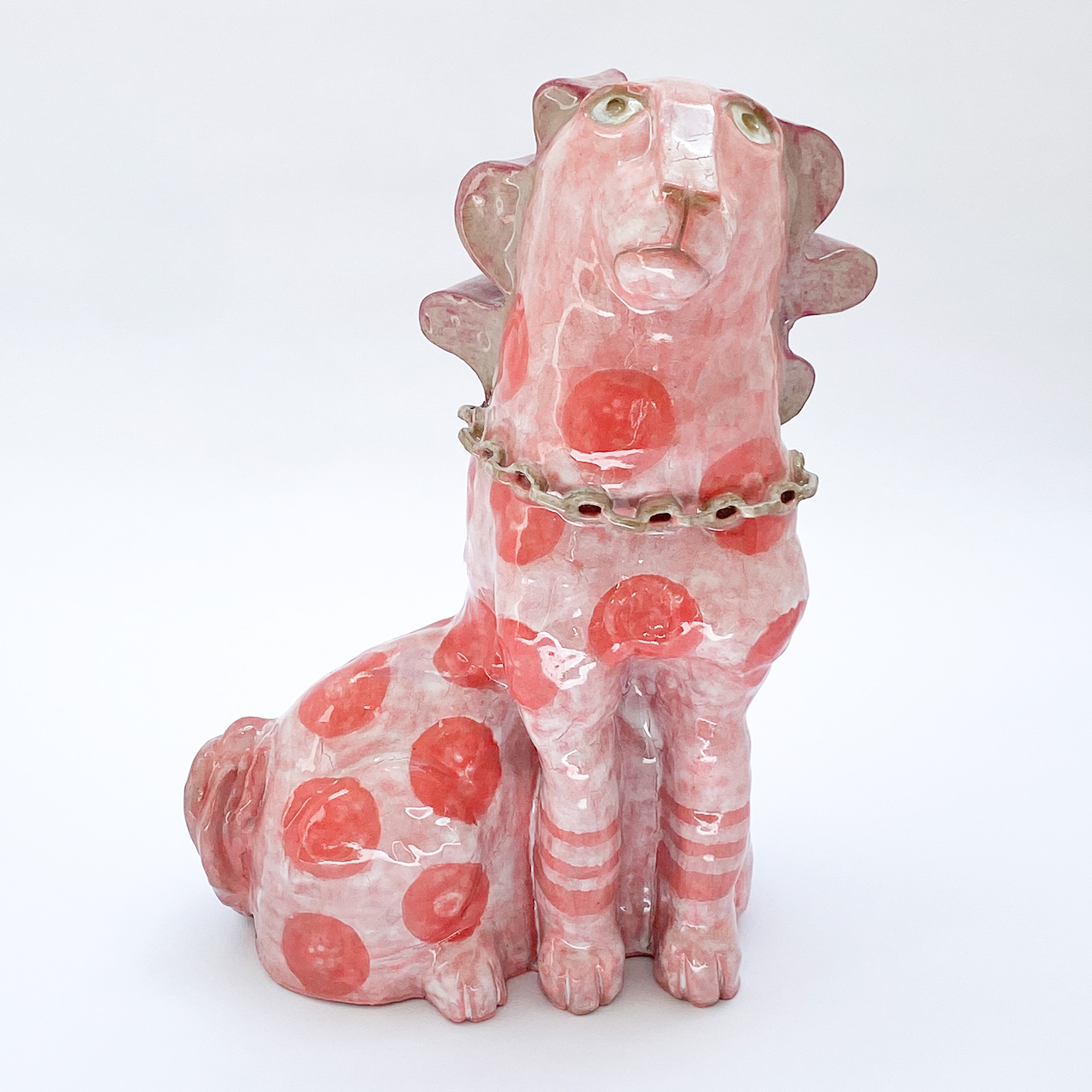 Sculpture of pink dog in glazed ceramic