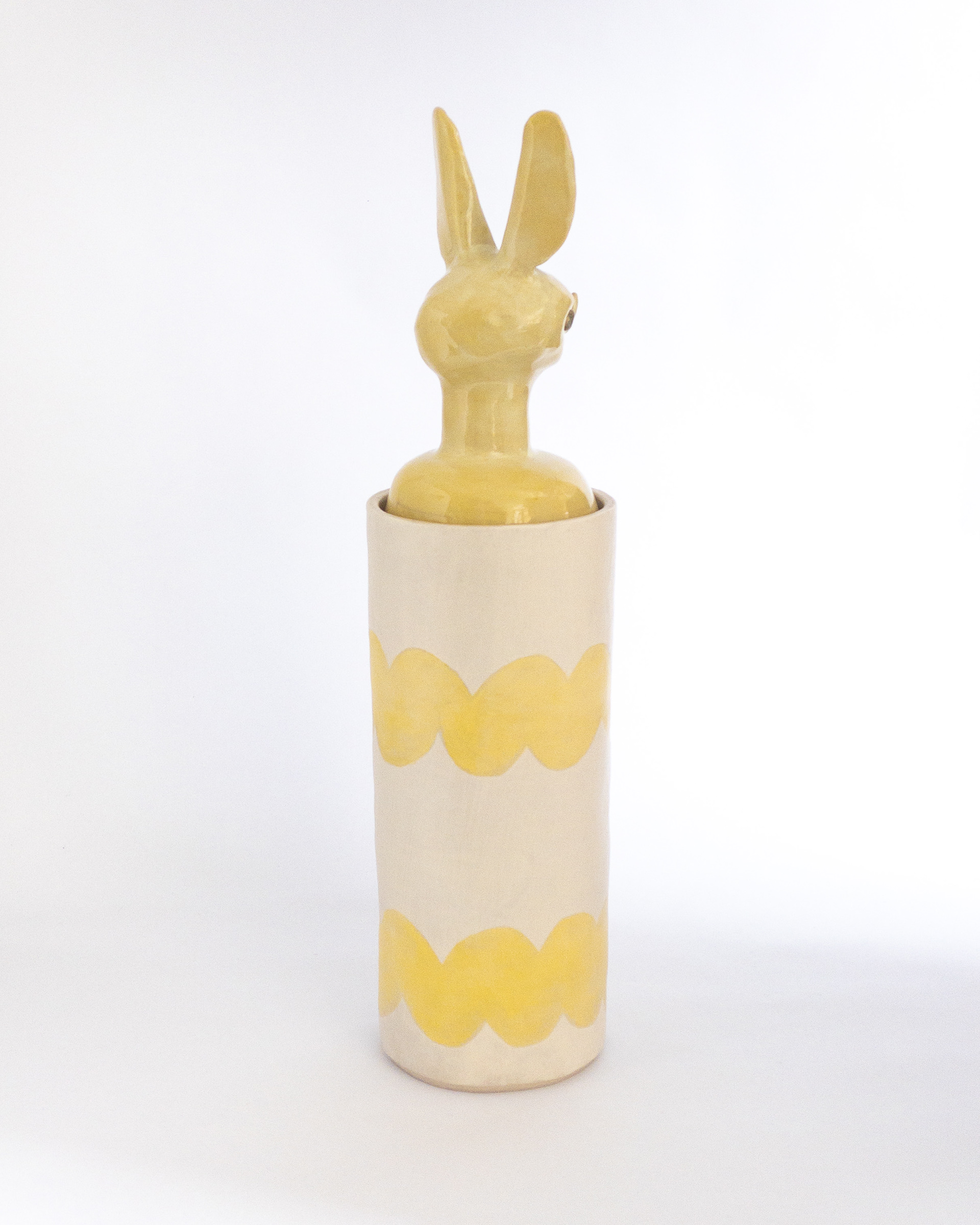 Yellow jar with bat head for lid in glazed ceramic