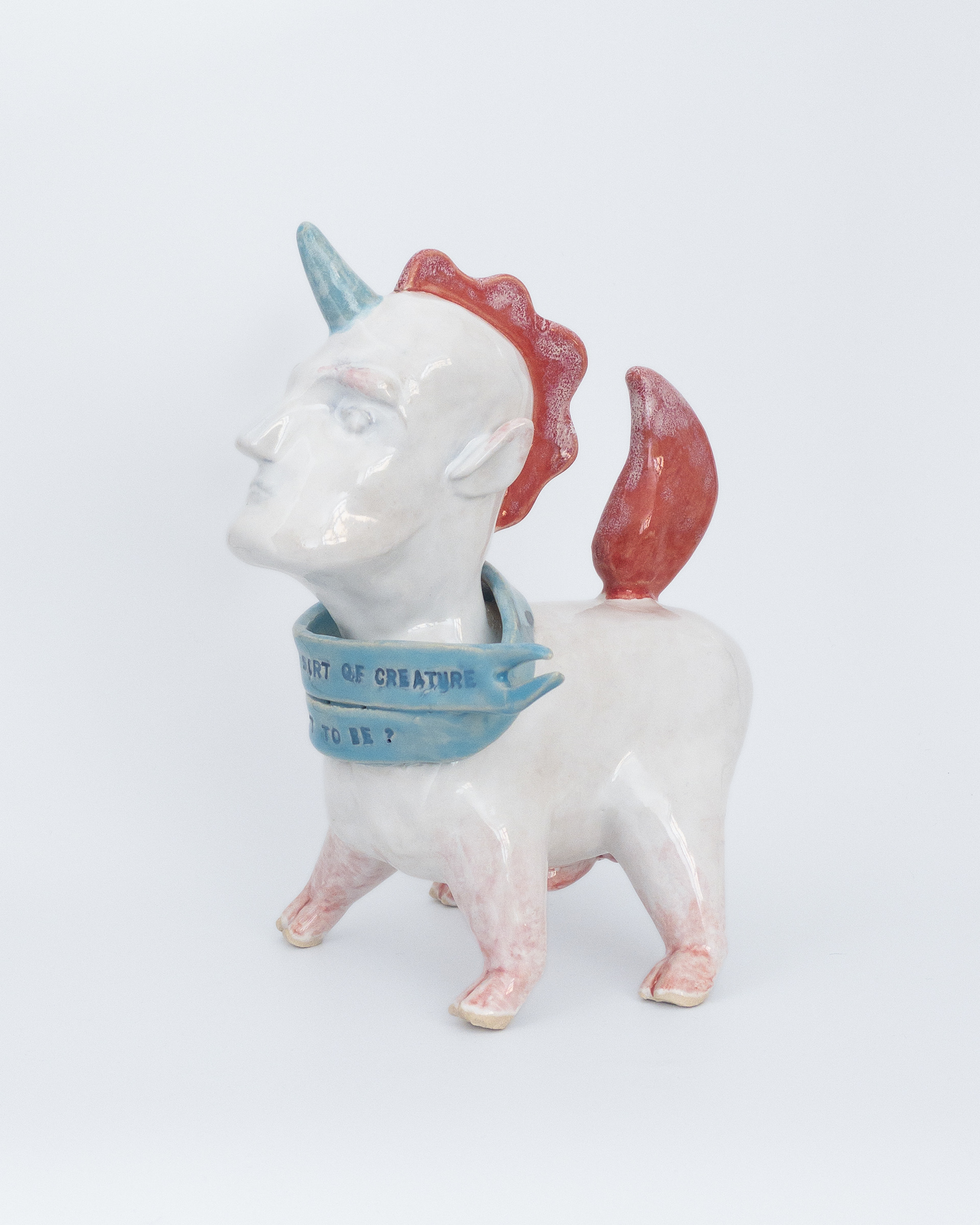 Sculpture of unicorn man in glazed ceramic
