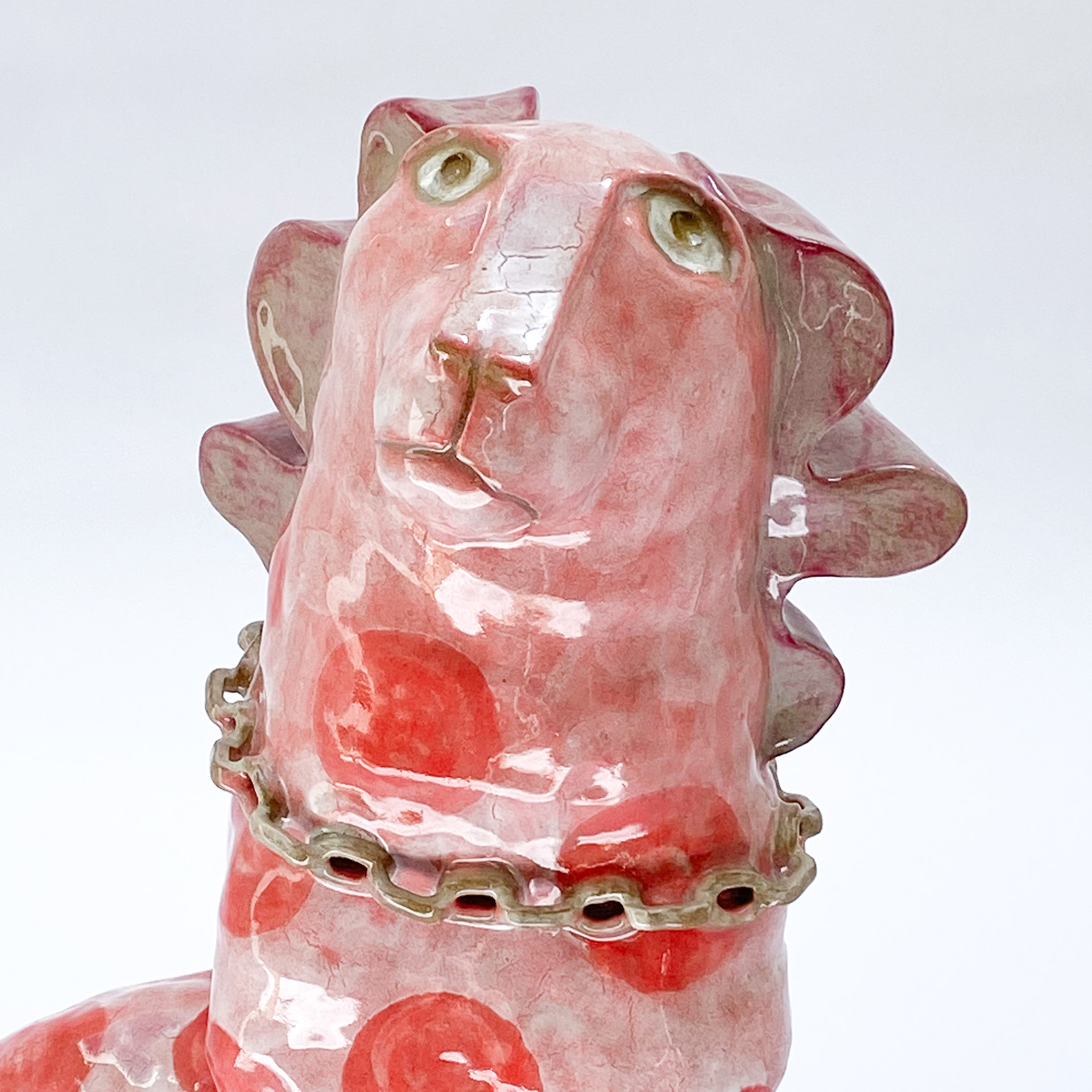 Sculpture of pink dog in glazed ceramic
