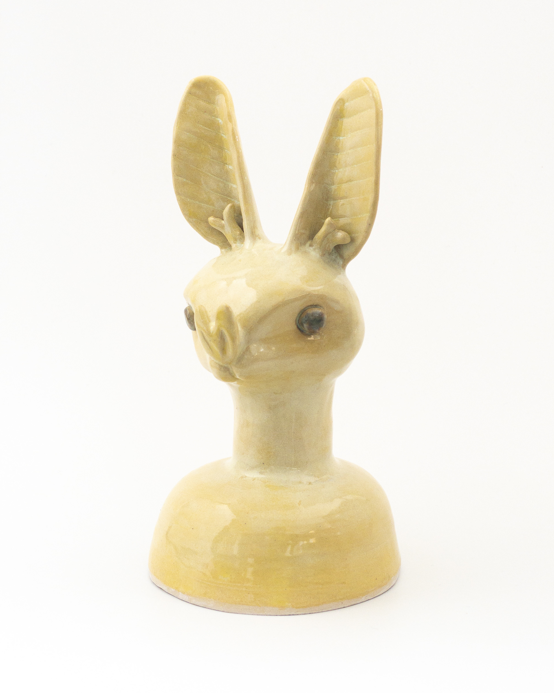 Yellow jar with bat head for lid in glazed ceramic