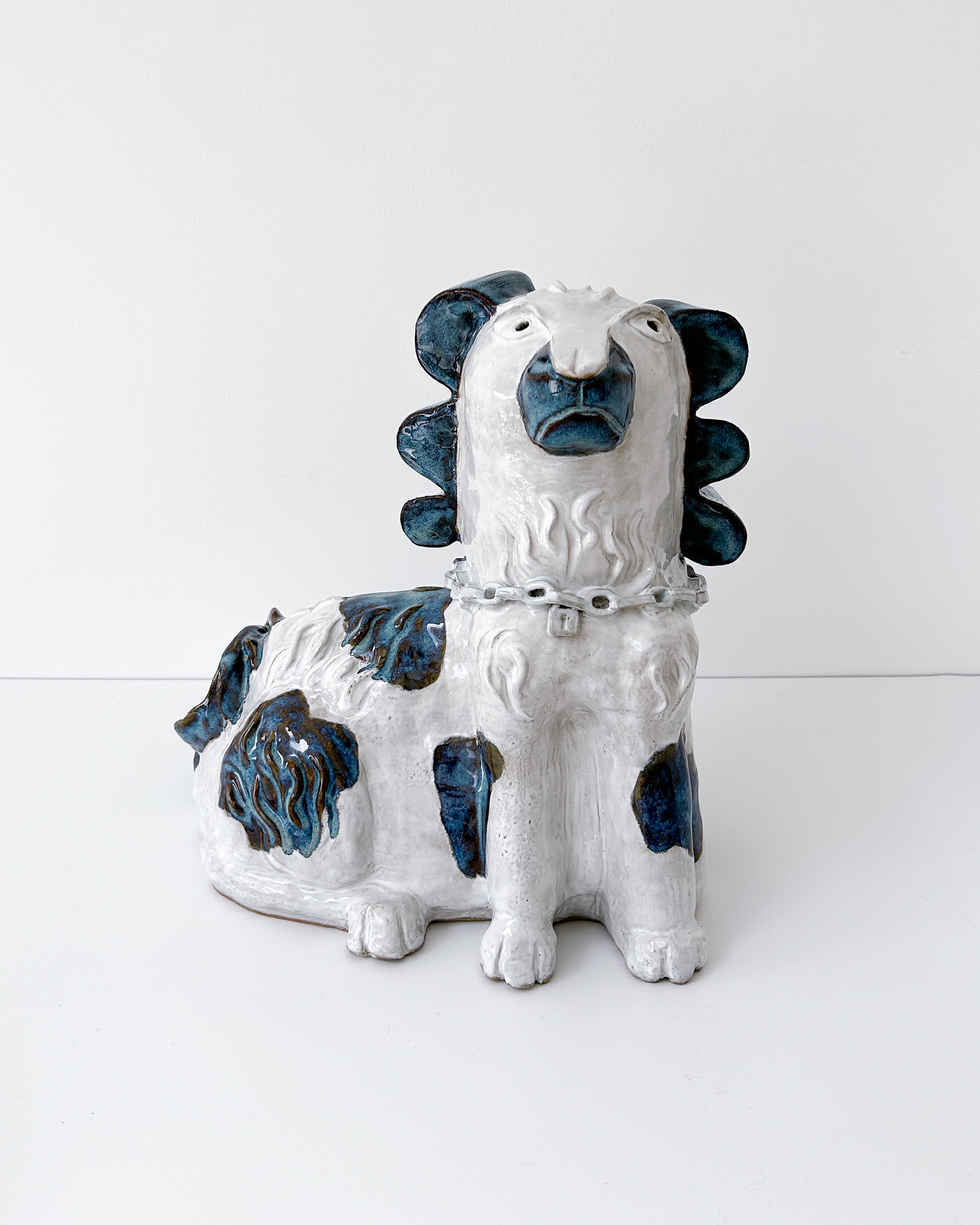 Blue and white spaniel sculpture in glazed ceramic