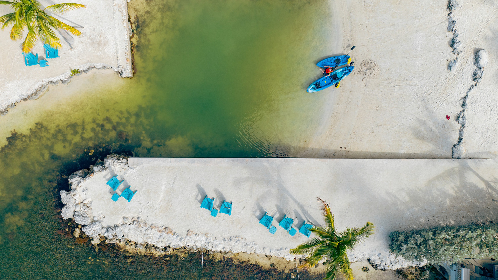 Aerial of a tropical beach with kayaks, drone photo