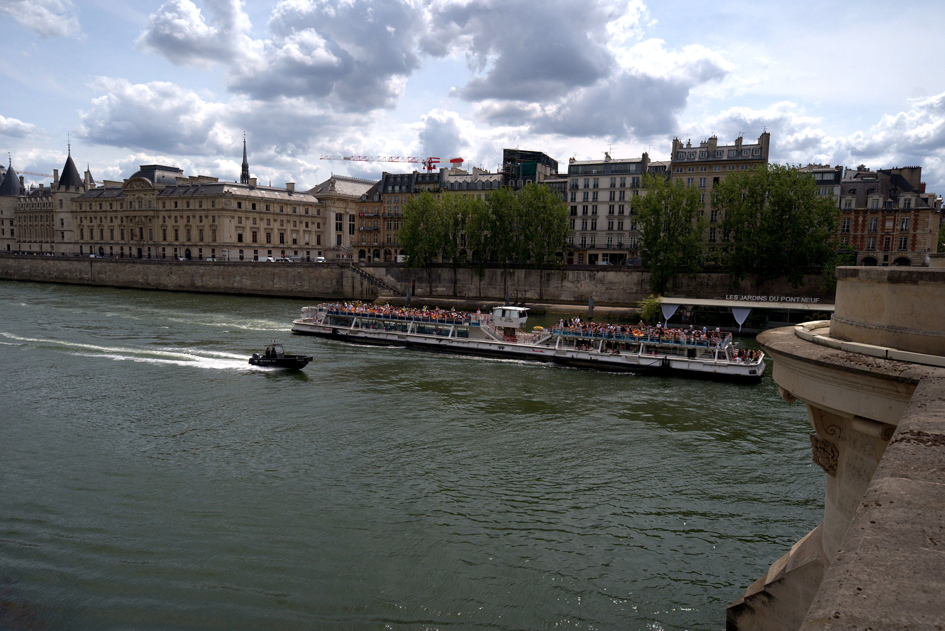 Paris 04: A boat on the Seine with the historic Paris riverbank skyline