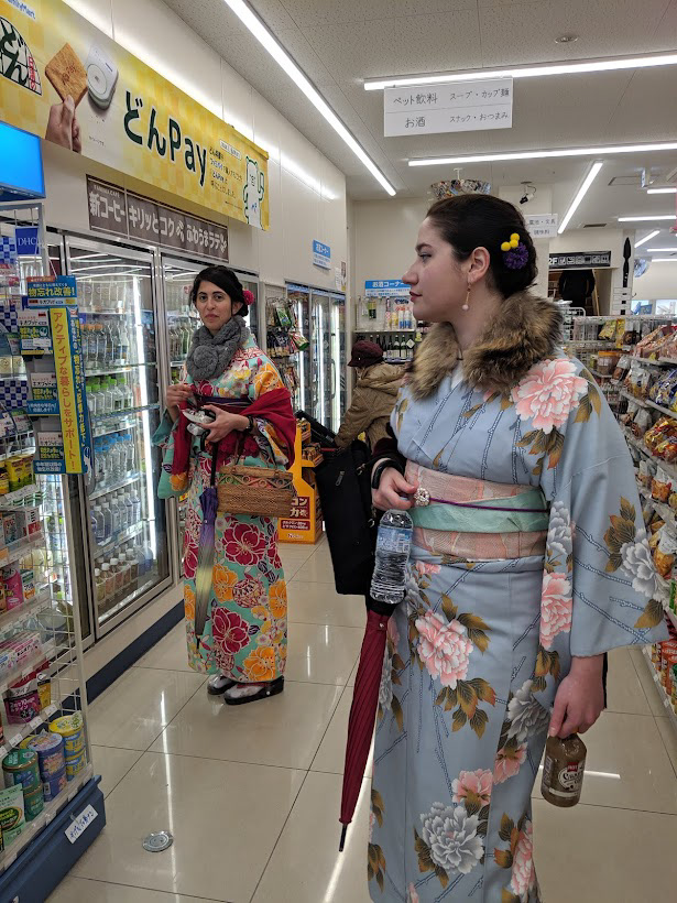 Wearing a kimono in a conbini. The Japanese grandmothers loved us when they saw us walking in Kimono