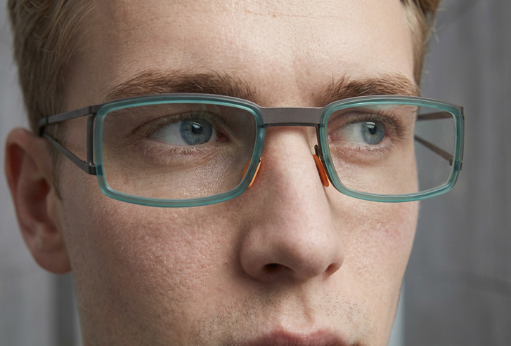  designed for personal customization, featuring interchangeable nose pads and side panels.