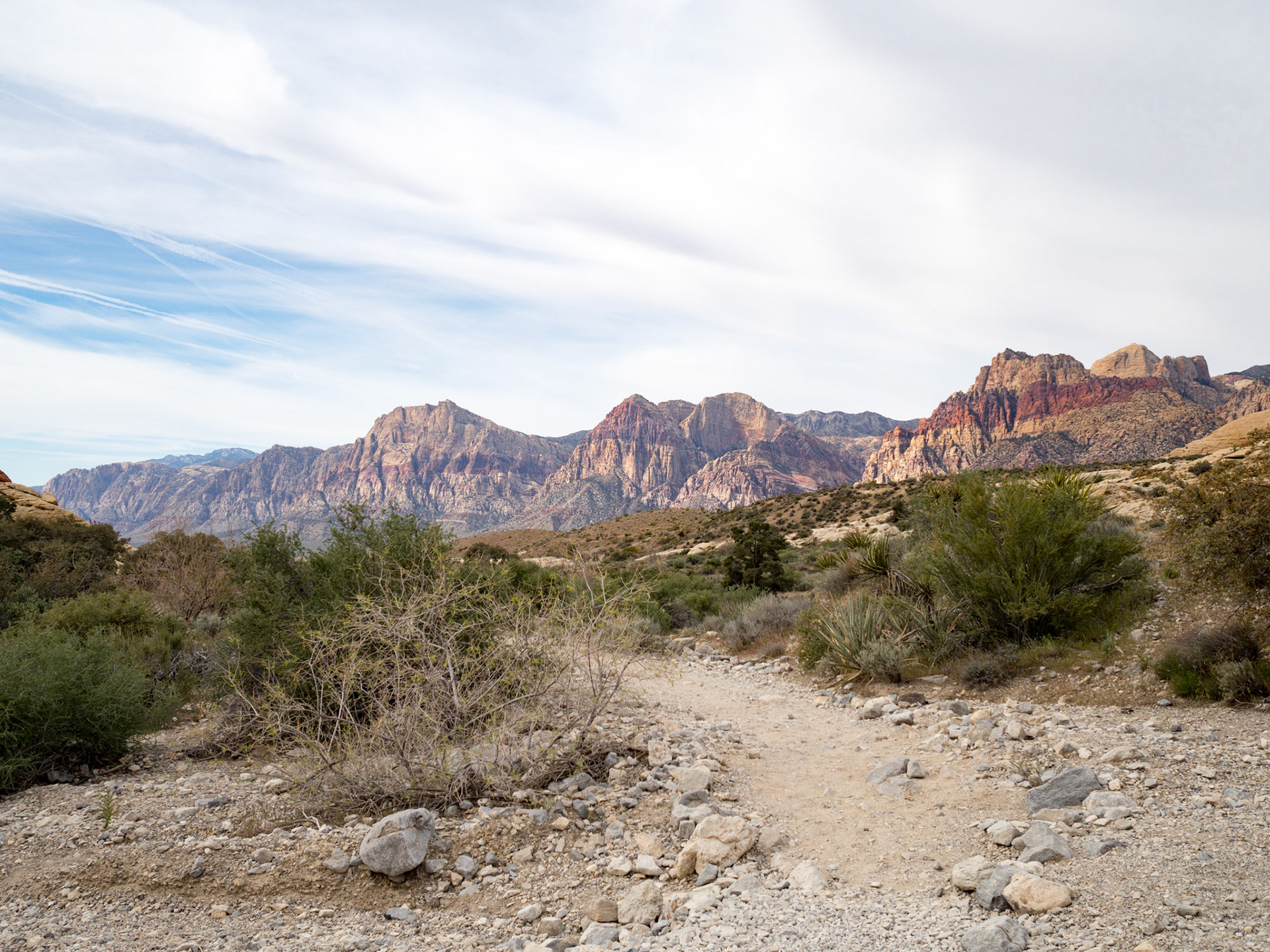 In October, 2015 I was in Las Vegas for AWS reInvent conference. One of the things I wish I had time for was visit the natural areas around Las Vegas. This time (March, 2016), however, we rented a car at Harrah’s and went hiking in the Red Rock Canyon National Conservation Area (https://en.wikipedia.org/wiki/Red_Rock_Canyon_National_Conservation_Area). There is no way to properly capture the beauty of the Red Rock, no way to pick a perfect lens or a perfect camera. You need to be there to fully appreciate it.

Note on the workflow: I am glad I took these photos using RAW+JPEG format. Normally I only shoot JPEG, but since I only recently got the Olympus PEN-F I wanted to be on the safe side and have RAW available to me. Somehow in the JPEGs the camera subdued the colors and blew out the highlights. Reds weren’t as red as I remember them, for instance, and the sky had more texture to it. Luckily, RAW had all that information and so I was able to easily post process the files in Lightroom.
