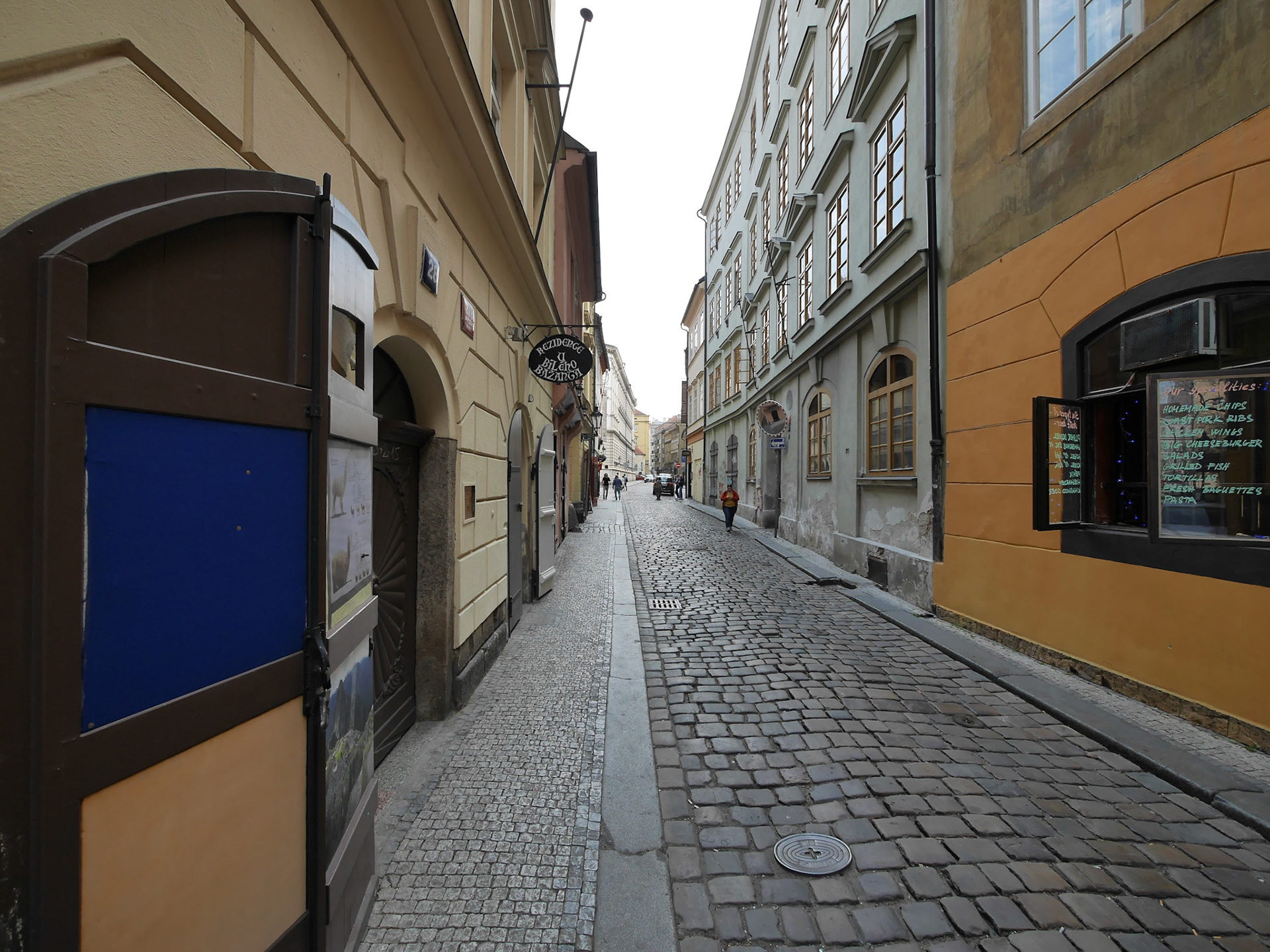 Observe the food kiosk on the right, with a menu in English.