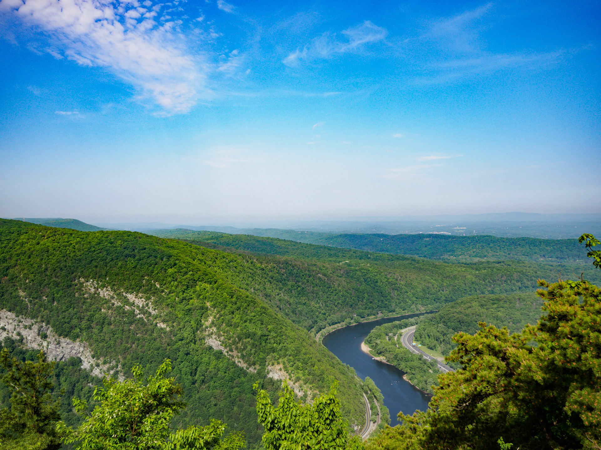 Mt. Tammany is a popular hiking destination in New Jersey. About an hour from the New York City, it gets crowded on the weekends. You need to come early, around 8am, to get a parking spot. Regardless of when you come, you won't have the trail all to yourself. But the trail is family friendly and there are multiple ways to get to the summit depending on the skill level. The trail offers spectacular views from the summit. Enjoy a swim in the natural ponds and waterfalls on a hot day.

Learn more at http://www.njhiking.com/mt-tammany/