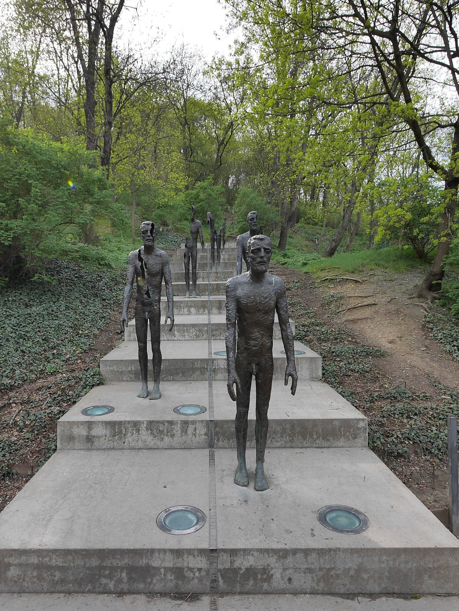 At each step part of the person is stripped, such that at the top there is only a faceless hollow shell.