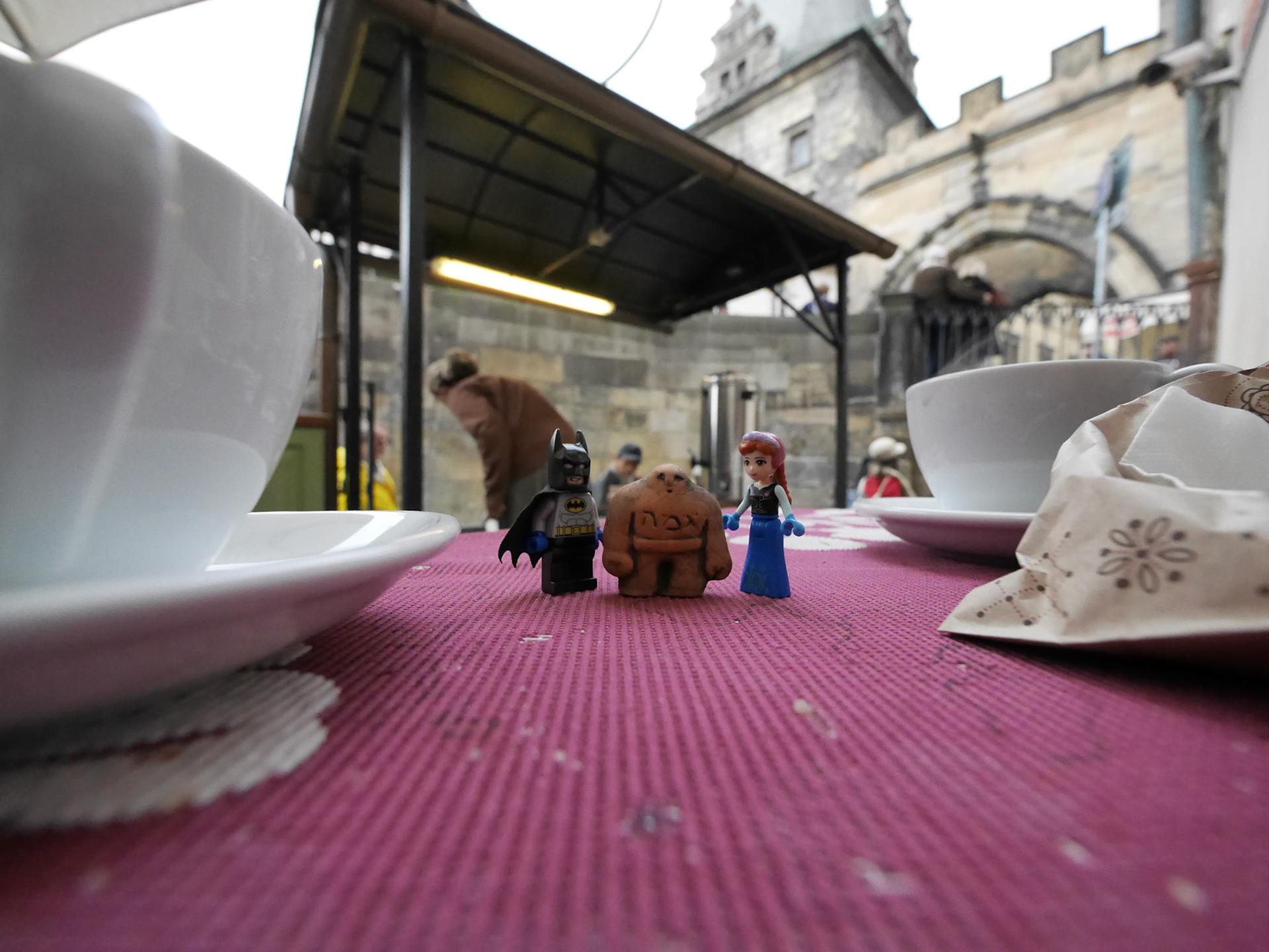 Lego Batman, Anna and their new friend Golem are having hot wine for breakfast