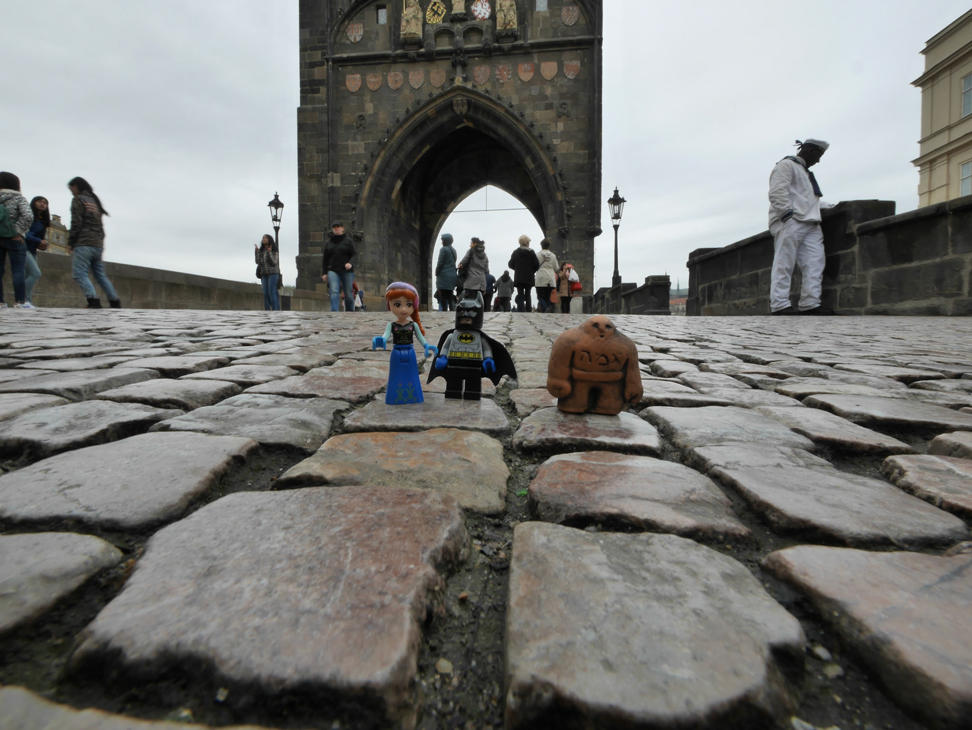 Our kids gave us their Lego figurines of Batman and Anna (from Frozen). While in Pragu'es Jewish Quarter we bought a little Golem figurine. We told the kids Anna and Batman made a new friend who is giving them tours of the city. Here they are about to walk over the Charles Bridge to the Old City.
