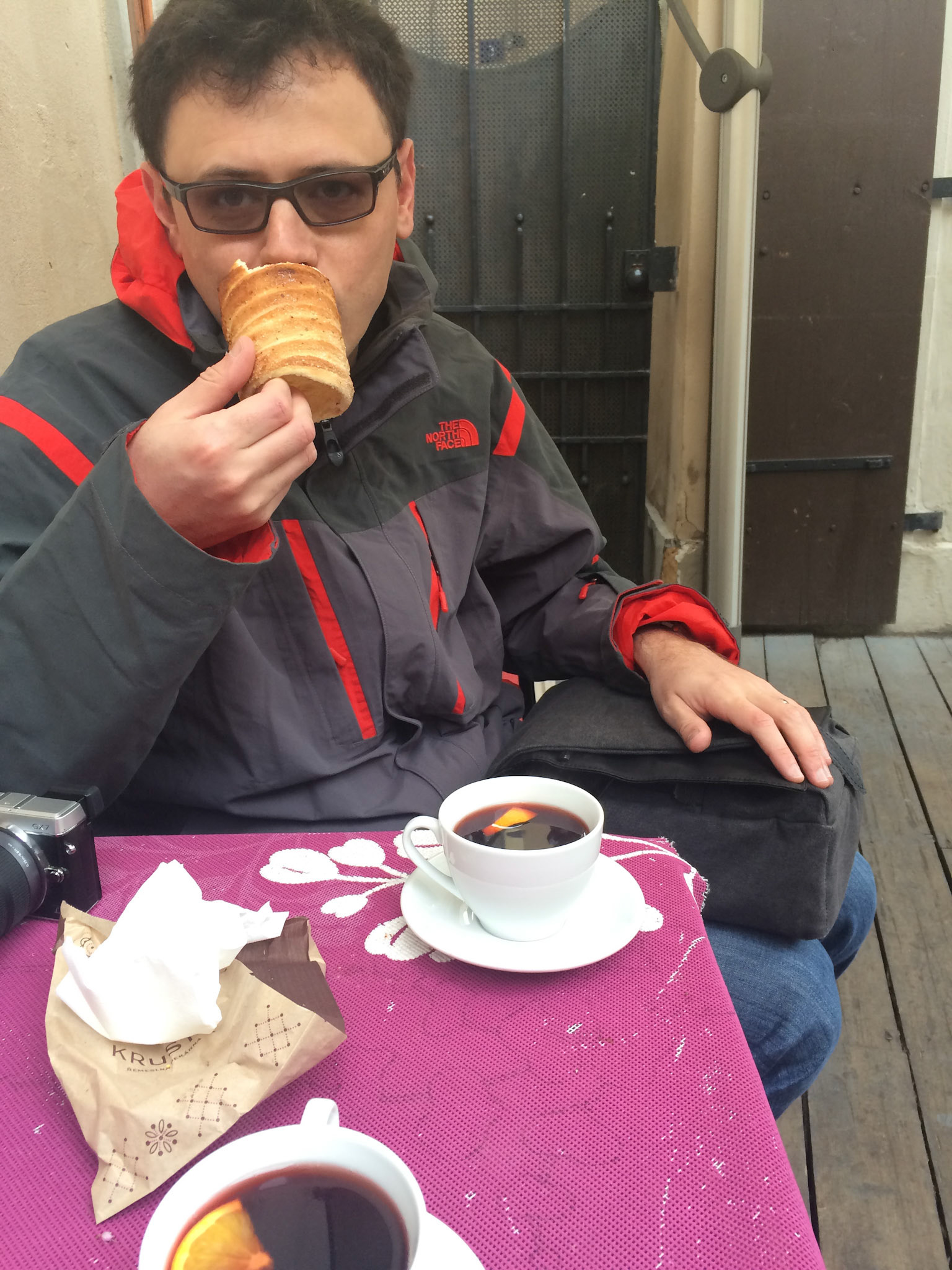 Nothing starts your day like a healthy breakfast of hot wine and trdlo. Trdlo is a Czech pastry -- they cook it over a charcoal grill and sprinkle with sugar and spices. I will talk about this more later, but for now -- this is yours truly eating a trdlo for breakfast with hot wine first thing in the morning :)