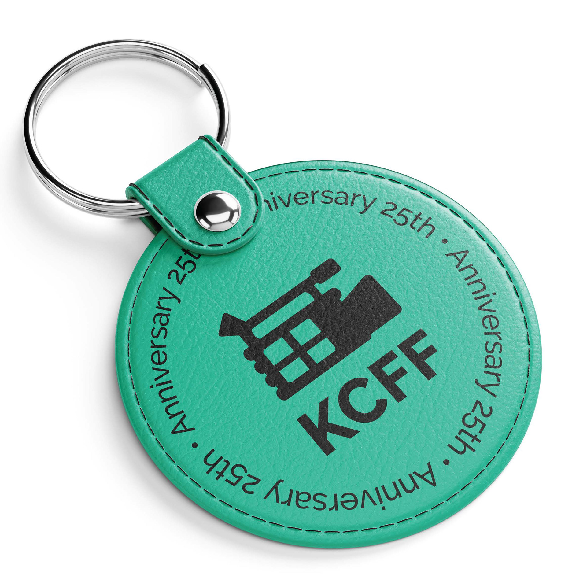 Mockup of teal keychain with KCFF and 25 anniversary.