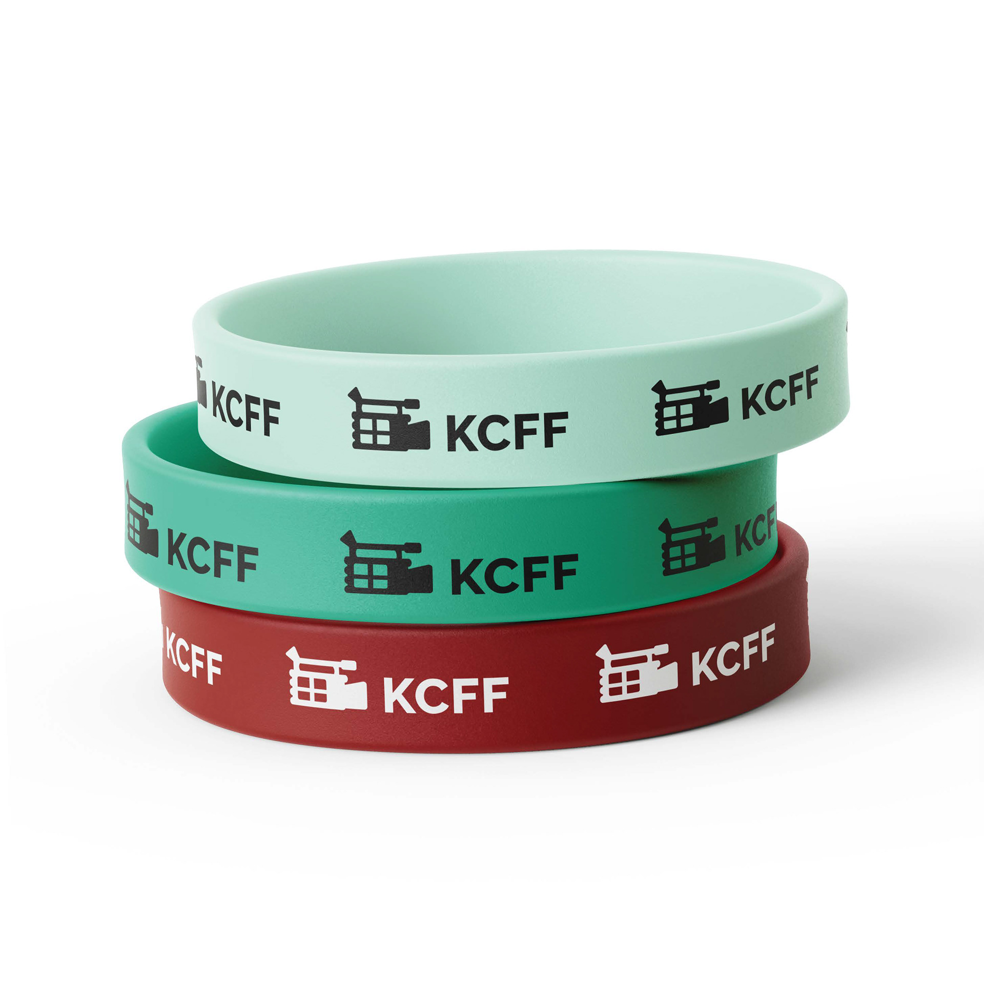 Mockup of 3 wristbands with KCFF icon. Colours are light teal, teal and red.