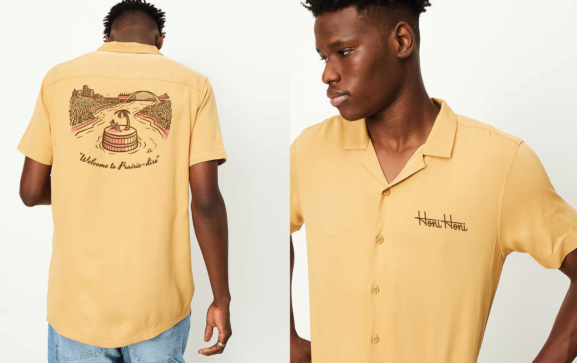 A man wears a pale yellow camp collar shirt with an illustration on the back, featuring a man lounging on top of a barrel in a river in Edmonton. Text below it reads "Welcome to Prairie-dise". The front of the shirt says Honi Honi in script lettering.