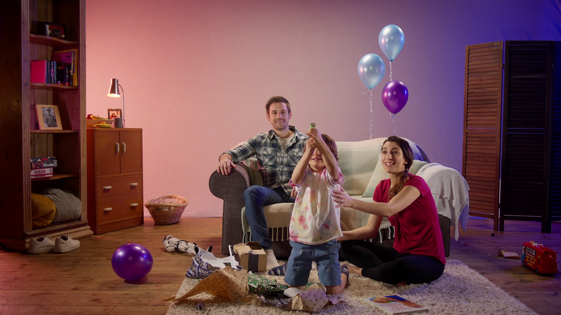 family with child pop a confetti cannon at birthday