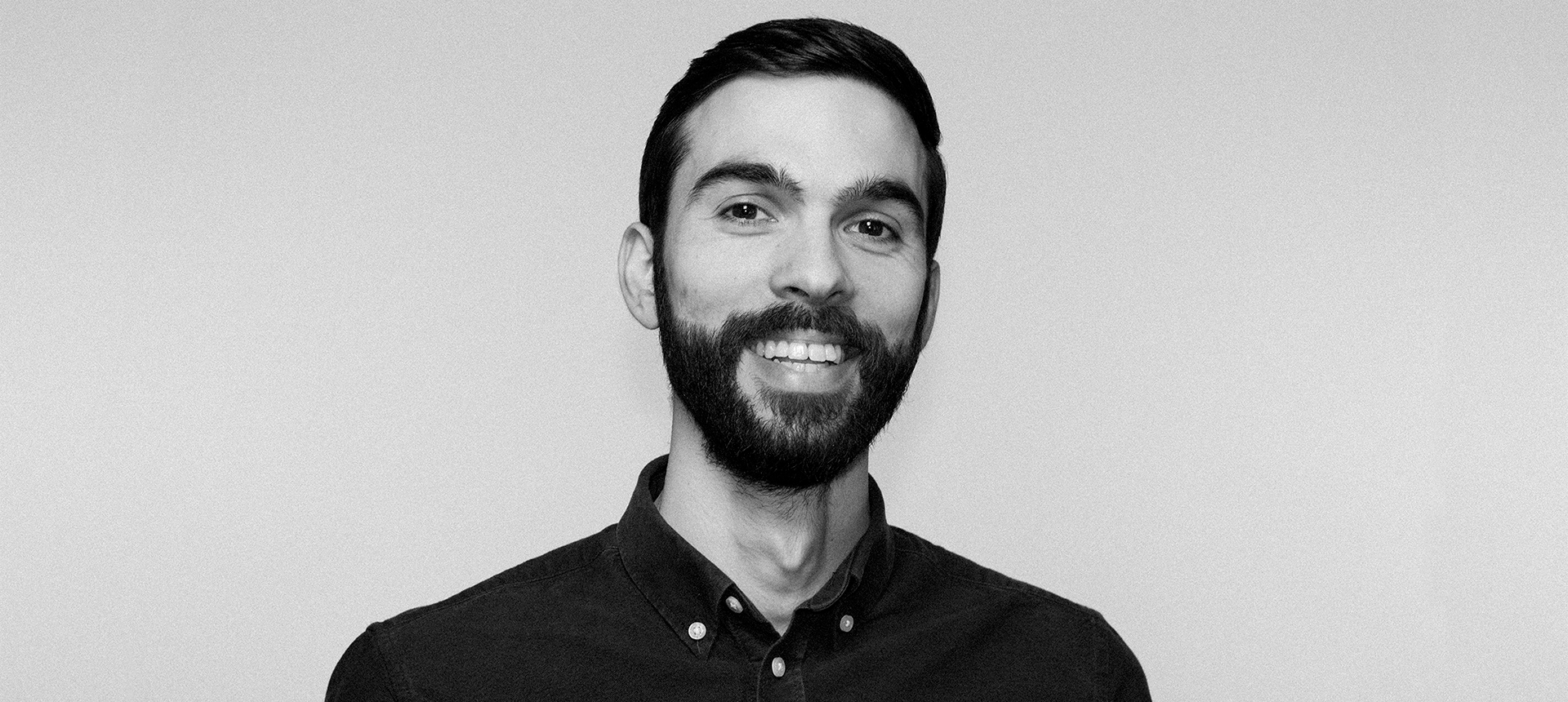 smiling portrait of vasil in black and white film