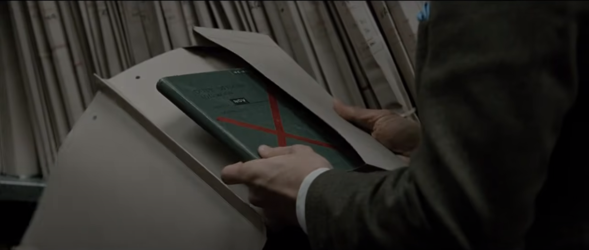 Peter Guillam (Benedict Cumberbatch) peruses secret dossier in TTSS (2011)