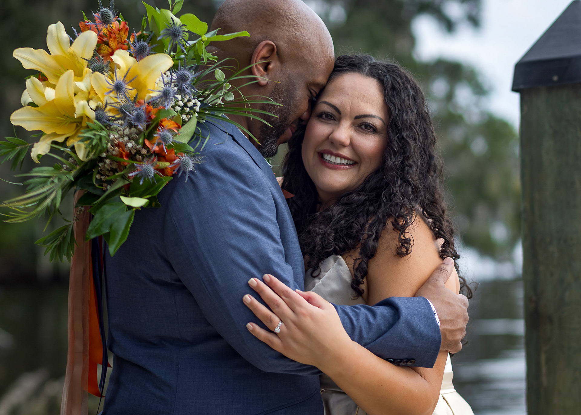 Bride & Groom embracing at Riverwalk in Jacksonville Wedding photography