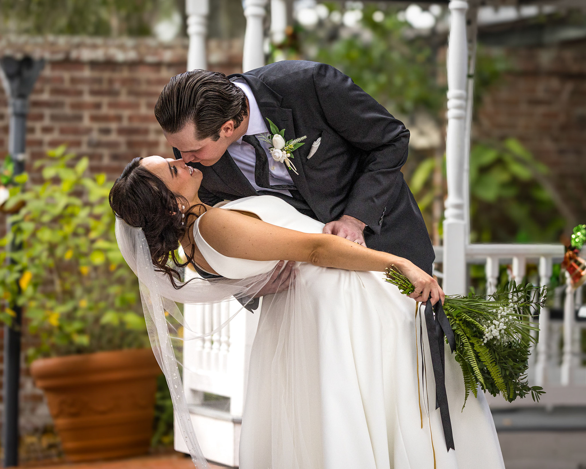 Couple sharing a kiss at their Downtown St. Augustine wedding