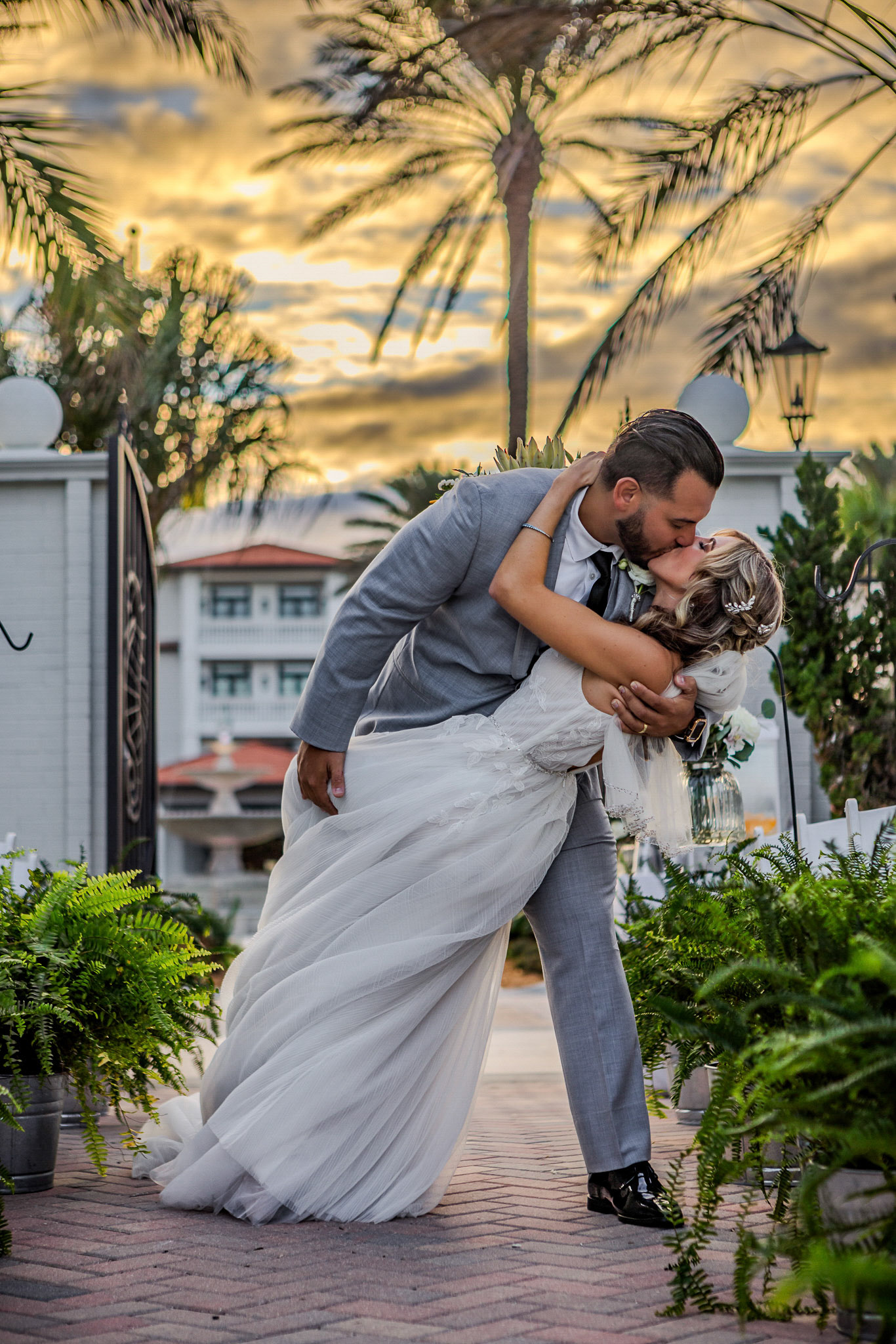 Couple sharing a kiss  at their Ponte Vedra Inn & Club wedding by Vimaris Photography