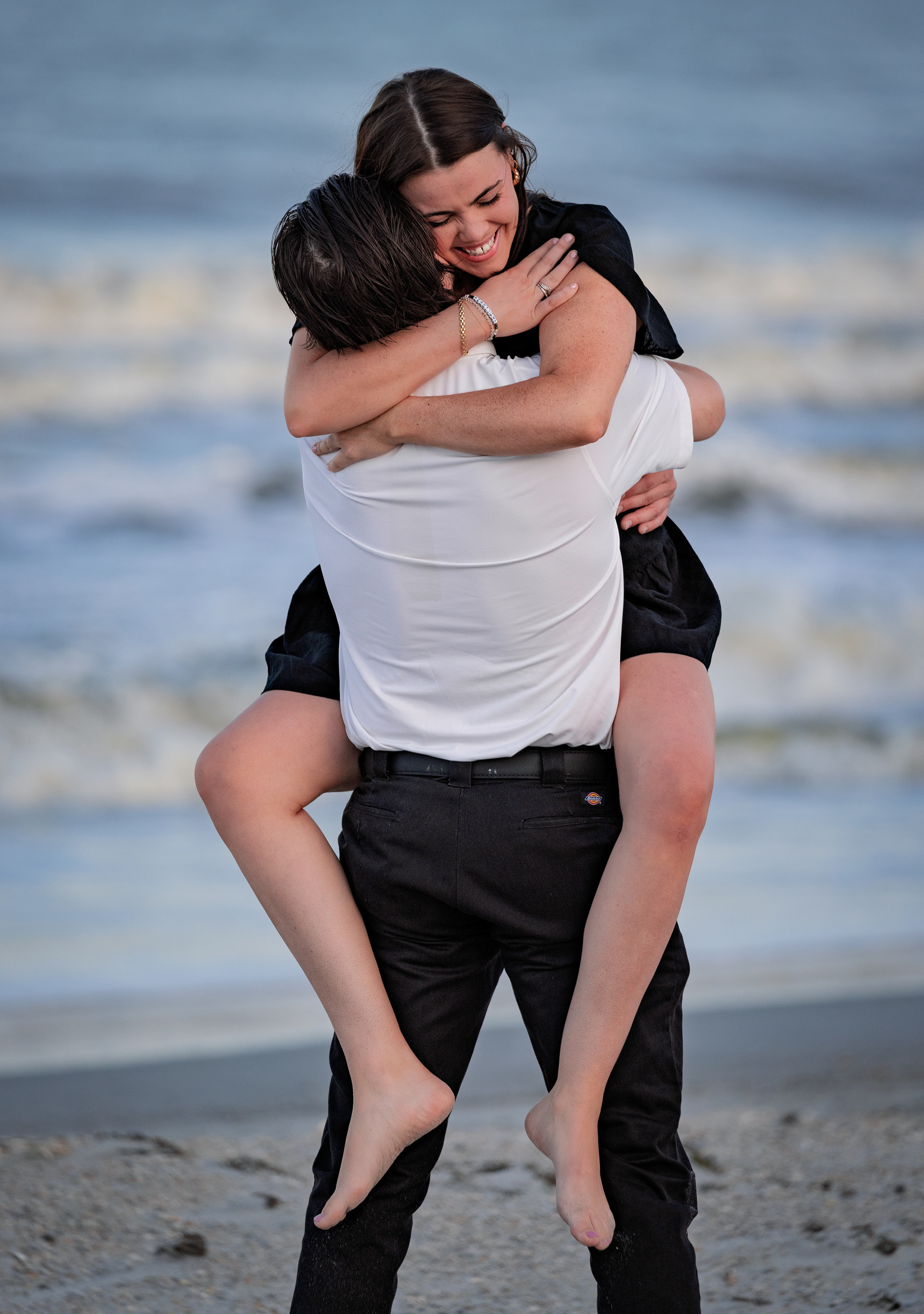 Emotional engaged couple celebrating a surprise proposal in Ponte Vedra Beach