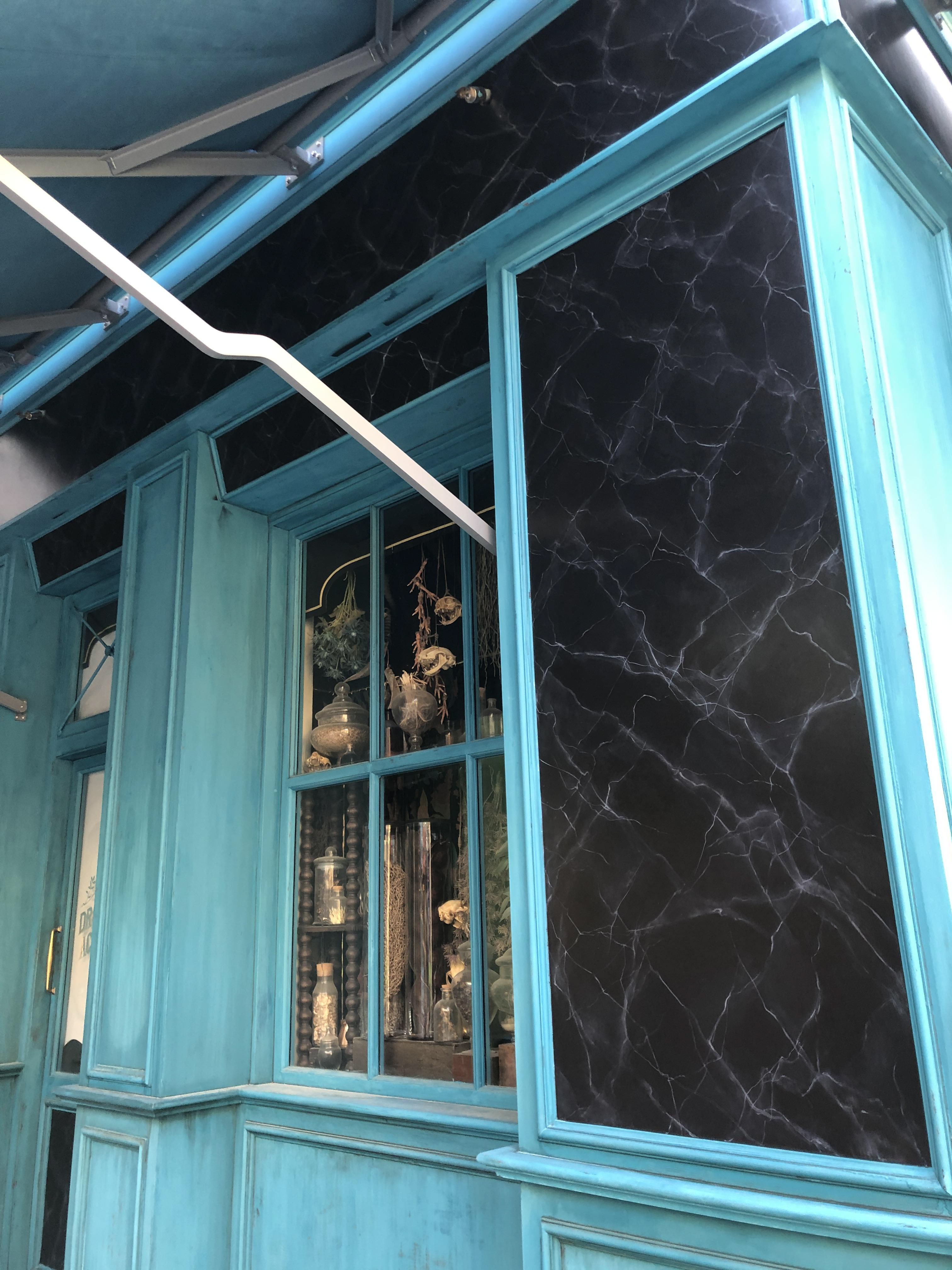 Hand painted faux black marble and building aging