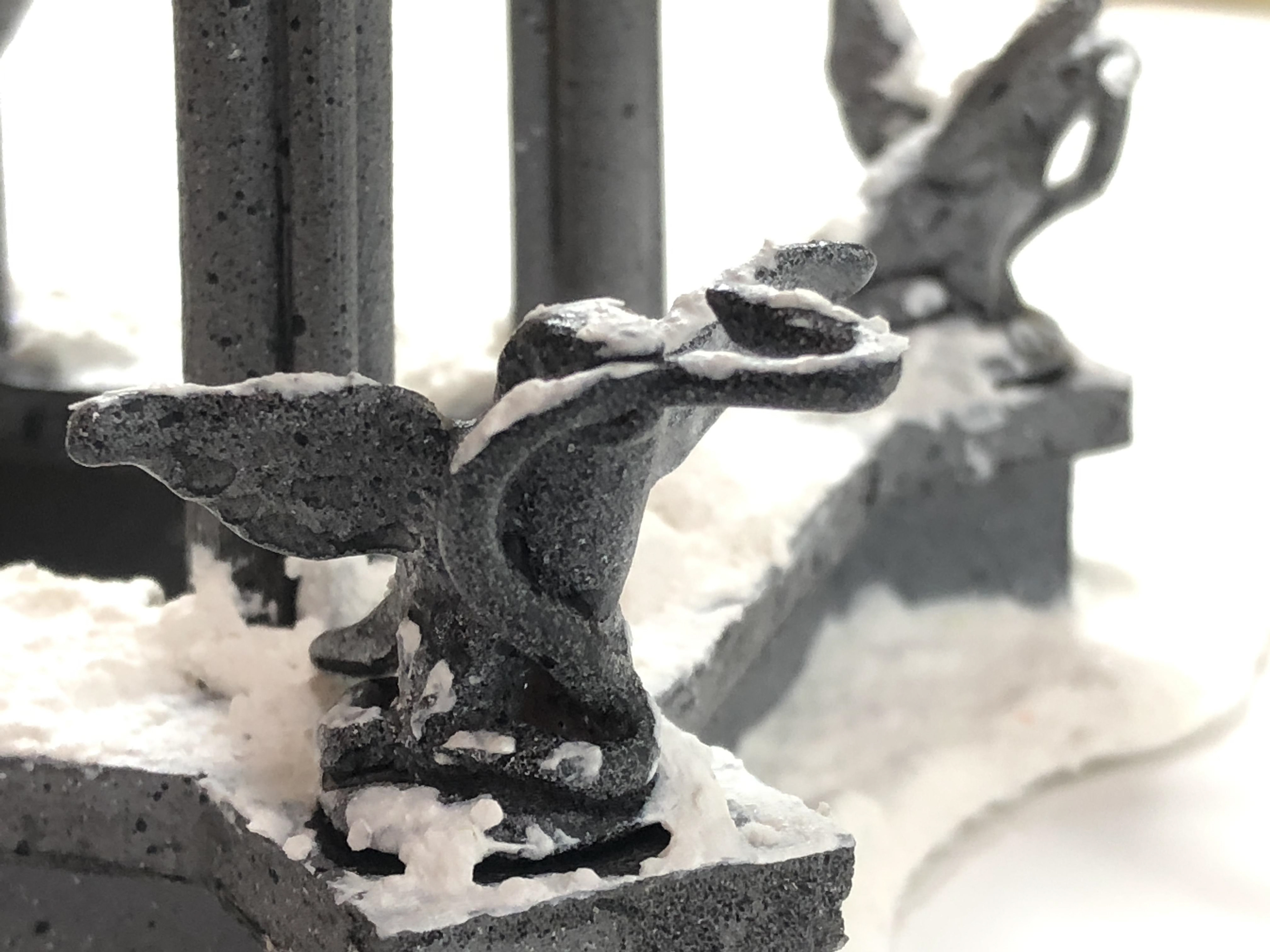 Detail snake in mouth Courtyard Well