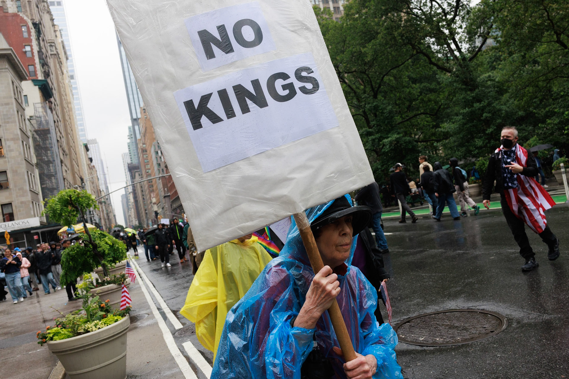 Protester Holds No Kings Sign in Rain