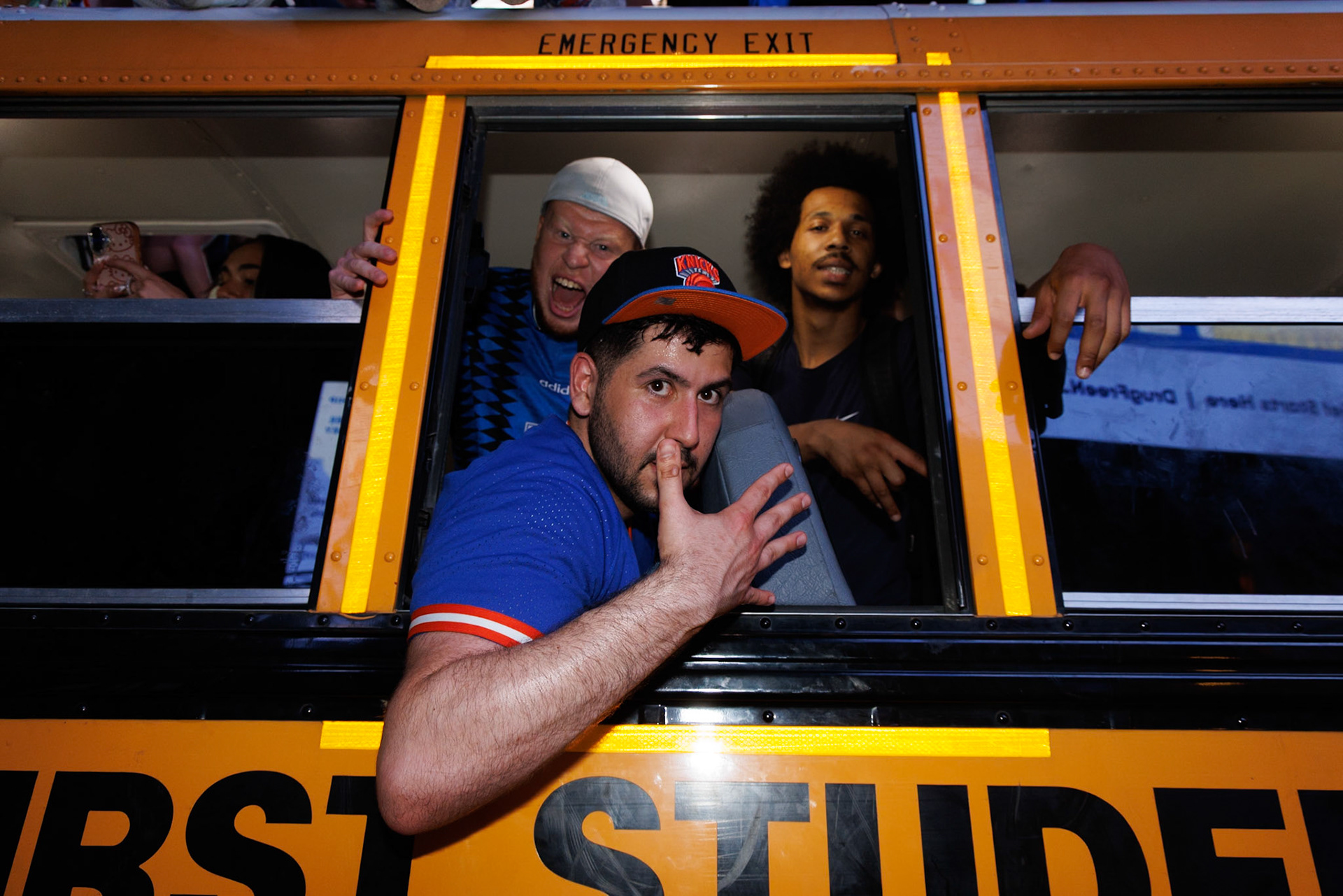 Knicks Fans Shouting from Yellow School Bus Window