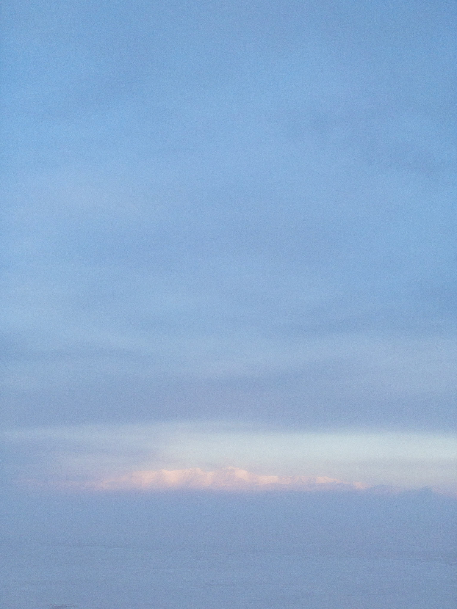 A thick haze over the sea ice blurs out the The Royal Society Range