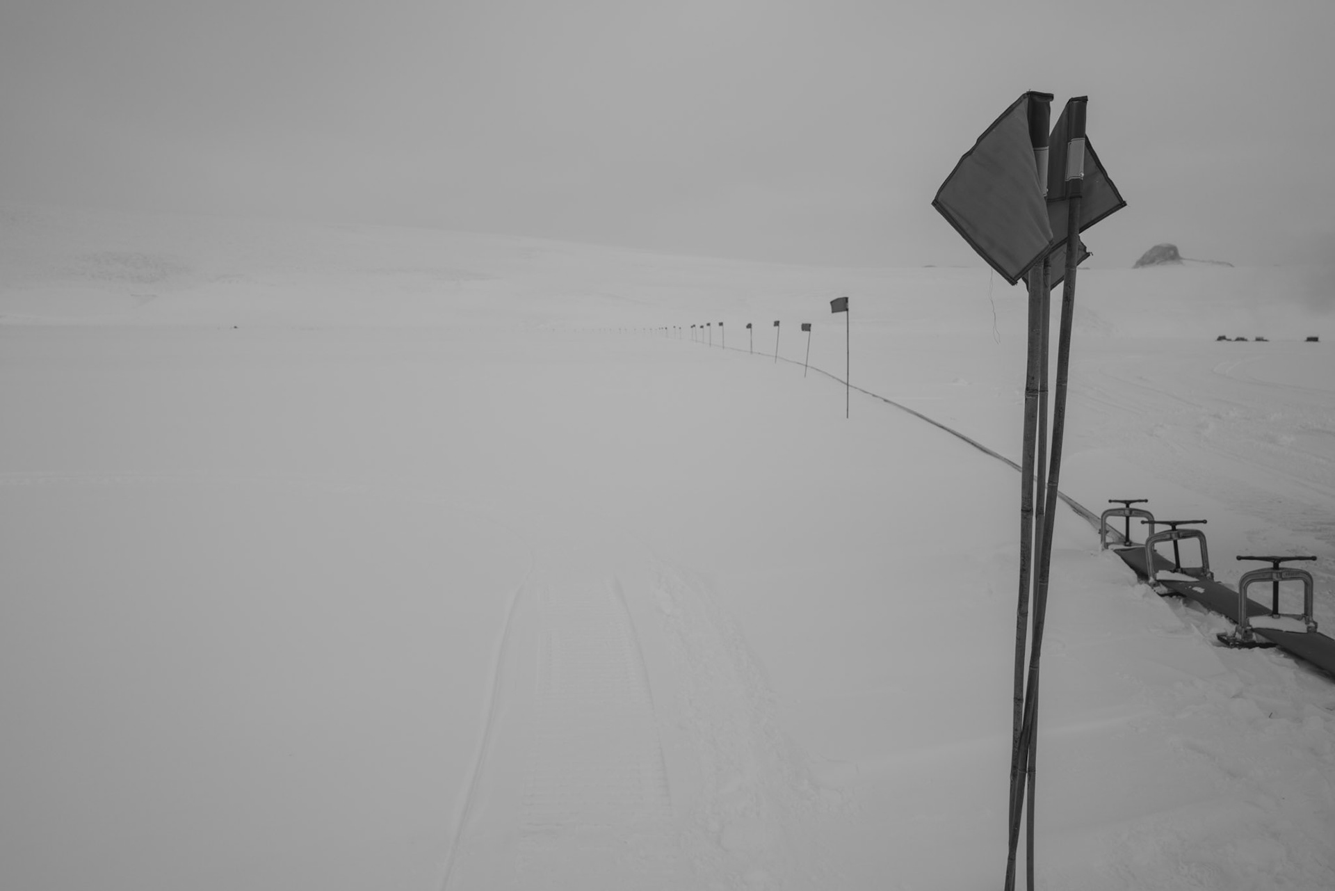 Blue flags planted along the seasonal fuel pipeline out to Willy Field